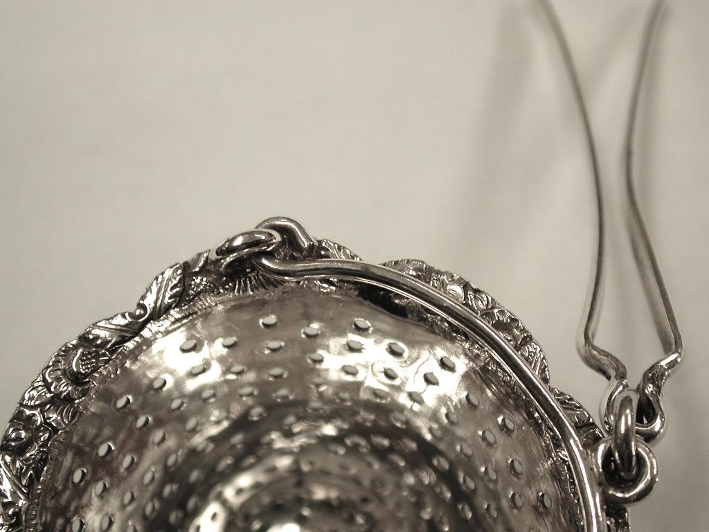 George IV silver tea strainer for the spout of a teapot ,1828, London
Assayed in London, and made by Charles Boyton.
Made especially for the spout of a teapot, with a silver spring which makes it fit
tight inside the spout
This style is normally