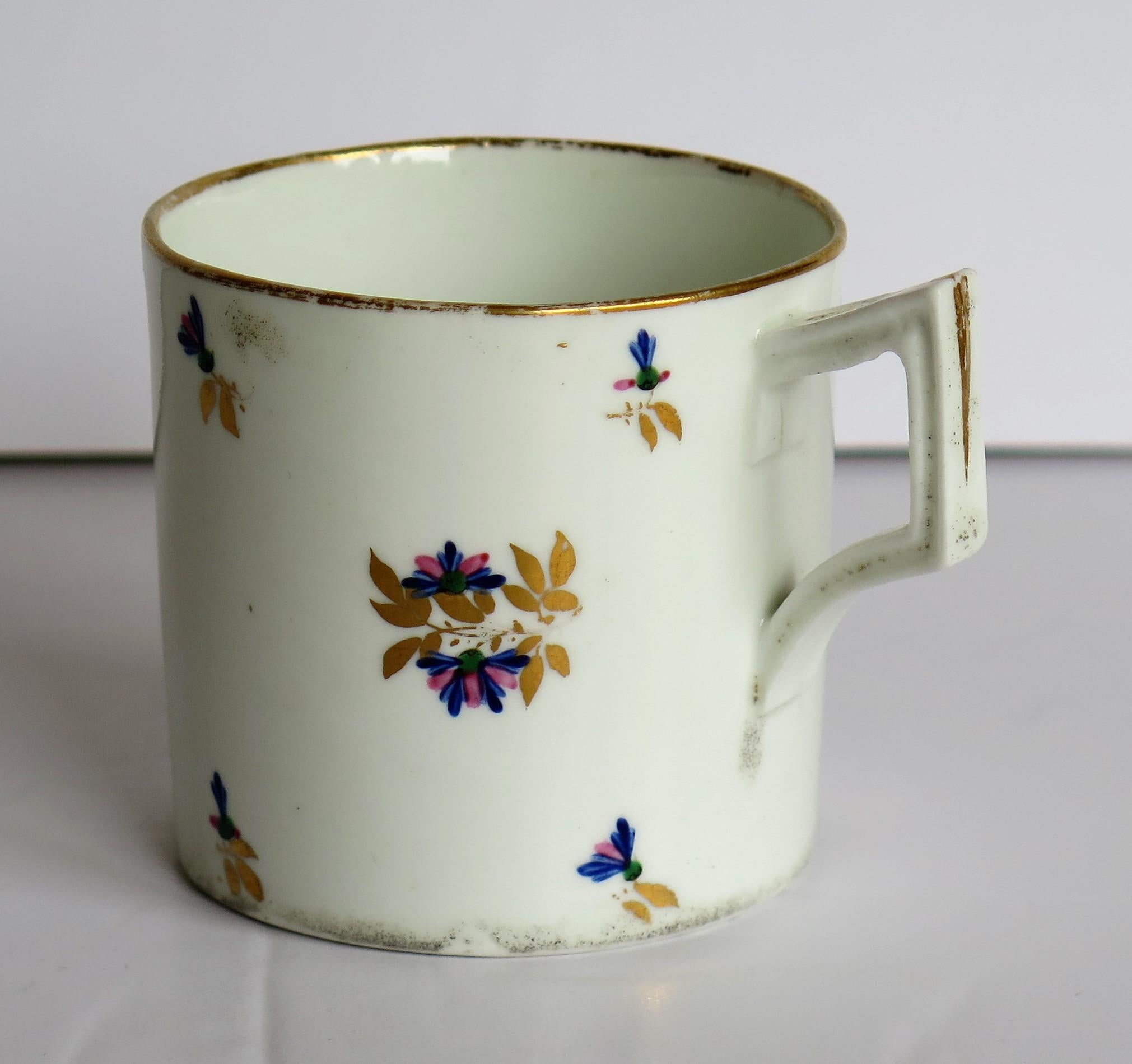 This is a good porcelain Coffee Can or cup hand painted and gilded in pattern 129, made by the Derby factory, in the reign of George 111 in the early 19th century, circa 1805 to 1810.

It is nominally straight sided with a square grooved