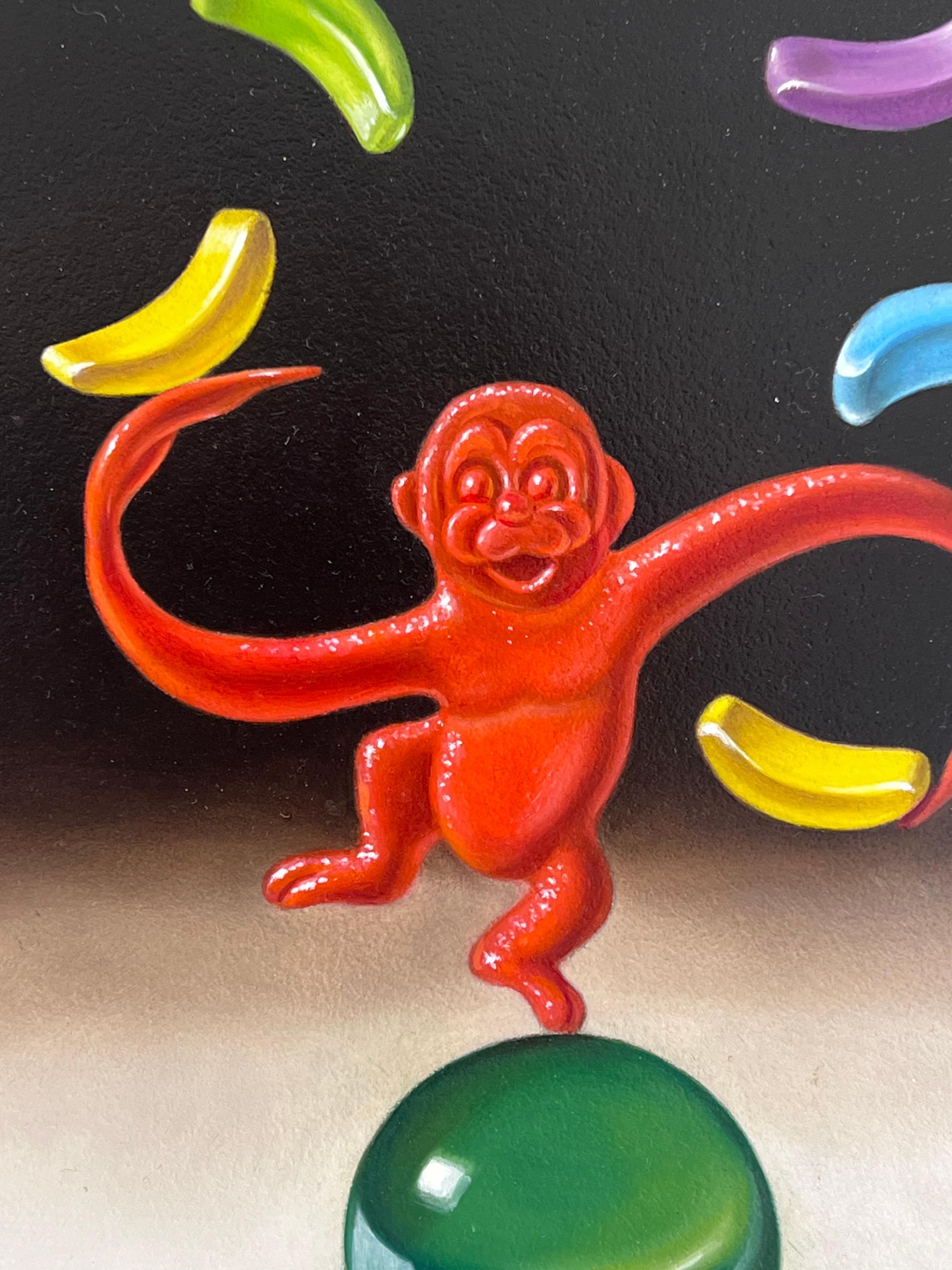 In “Monkey Around,” George A. Gonzalez transports the viewer into a whimsical world where imagination knows no bounds. At the center of the canvas, a vibrant red monkey with elongated limbs stands precariously on one leg atop a glass ball. With