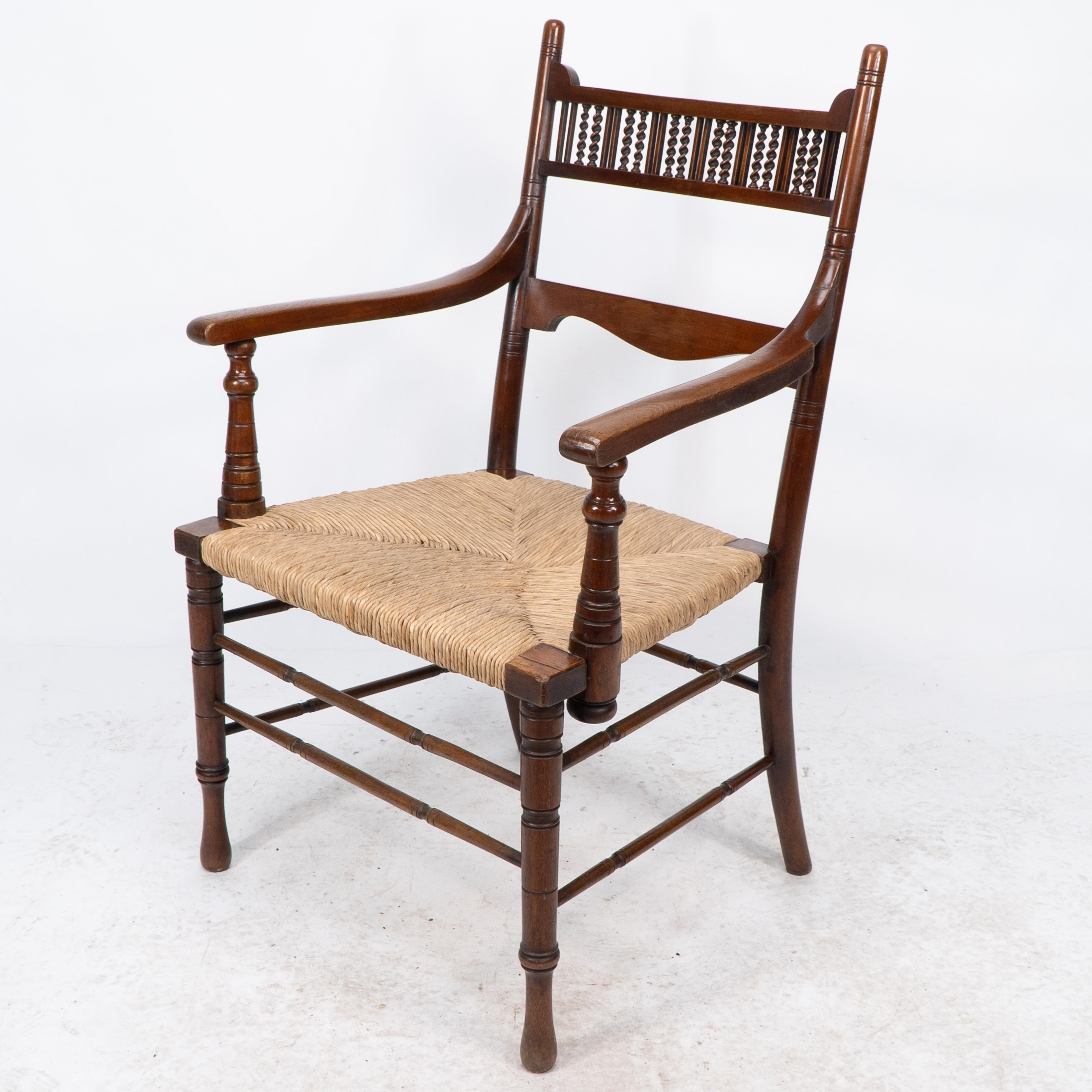English George Bell & George Freeth Roper Aesthetic Movement Walnut rush seat armchair. For Sale