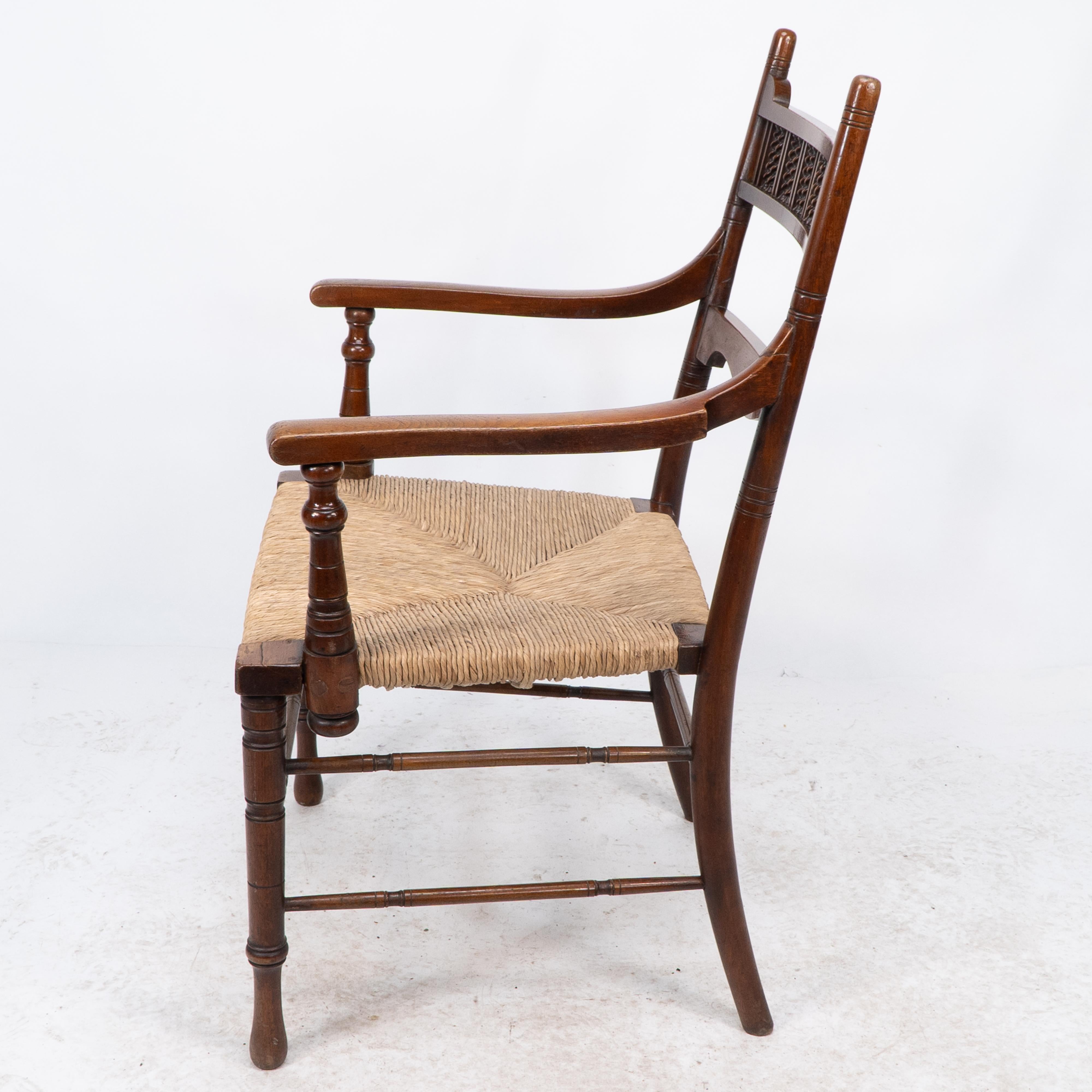 George Bell & George Freeth Roper Aesthetic Movement Walnut rush seat armchair. In Good Condition For Sale In London, GB