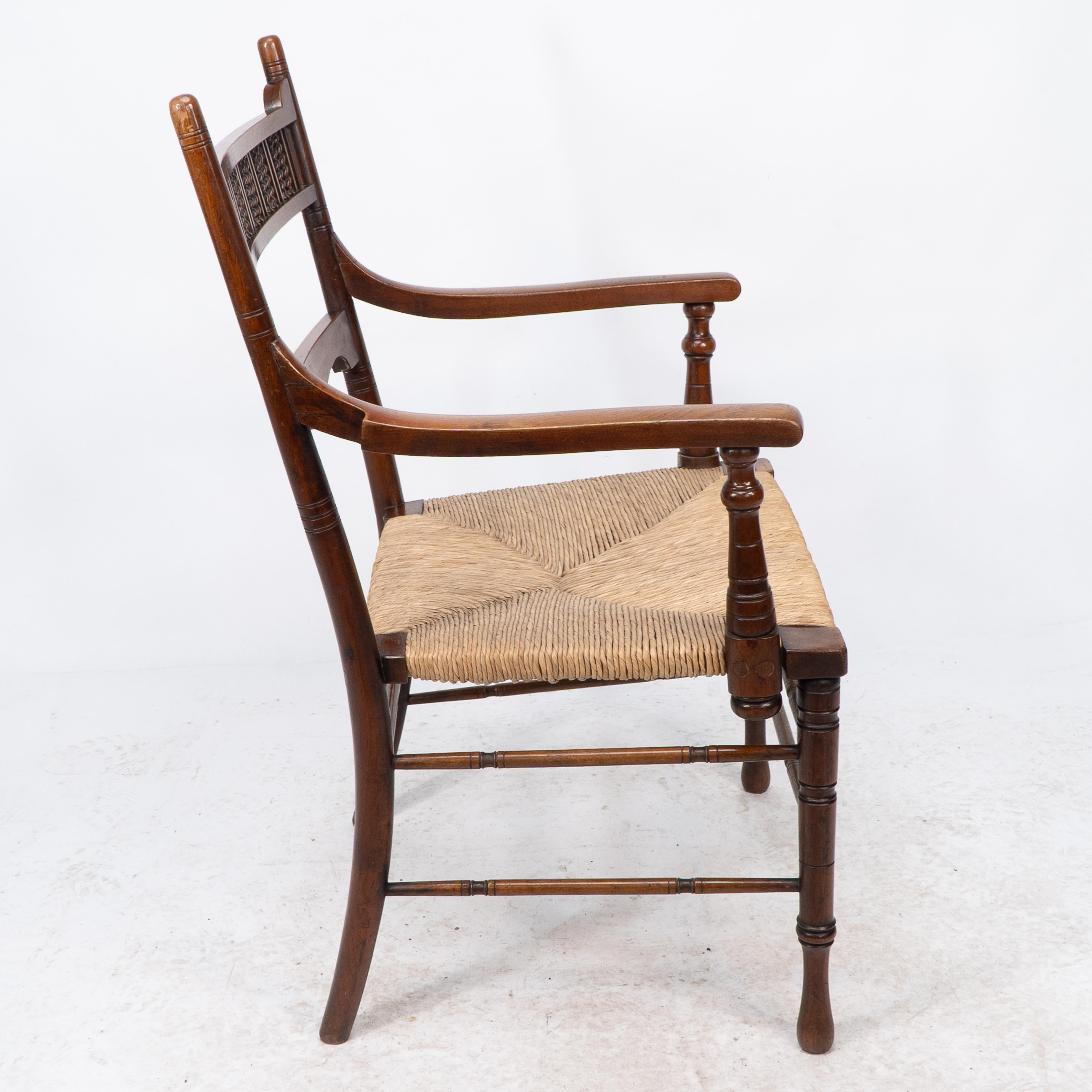 Late 19th Century George Bell & George Freeth Roper Aesthetic Movement Walnut rush seat armchair. For Sale