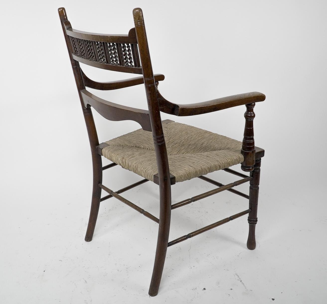 George Bell & George Freeth Roper Aesthetic Movement Walnut rush seat armchair. For Sale 2