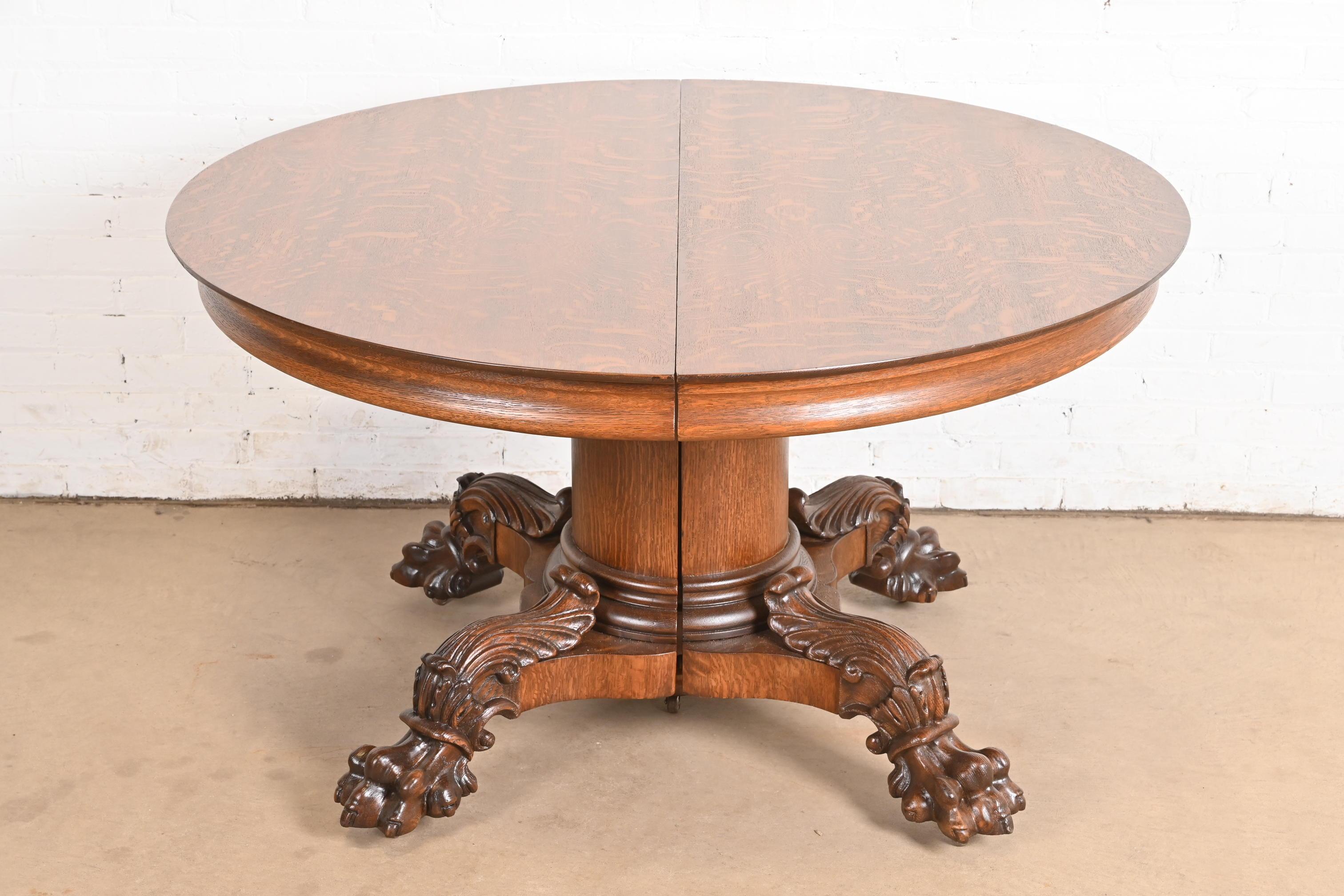An exceptional antique Victorian or Renaissance Revival pedestal extension dining table

By George C. Flint Co.

USA, Circa 1890s

Gorgeous quarter sawn oak, with carved split pedestal with ornate paw feet on casters.

Measures: 53.25