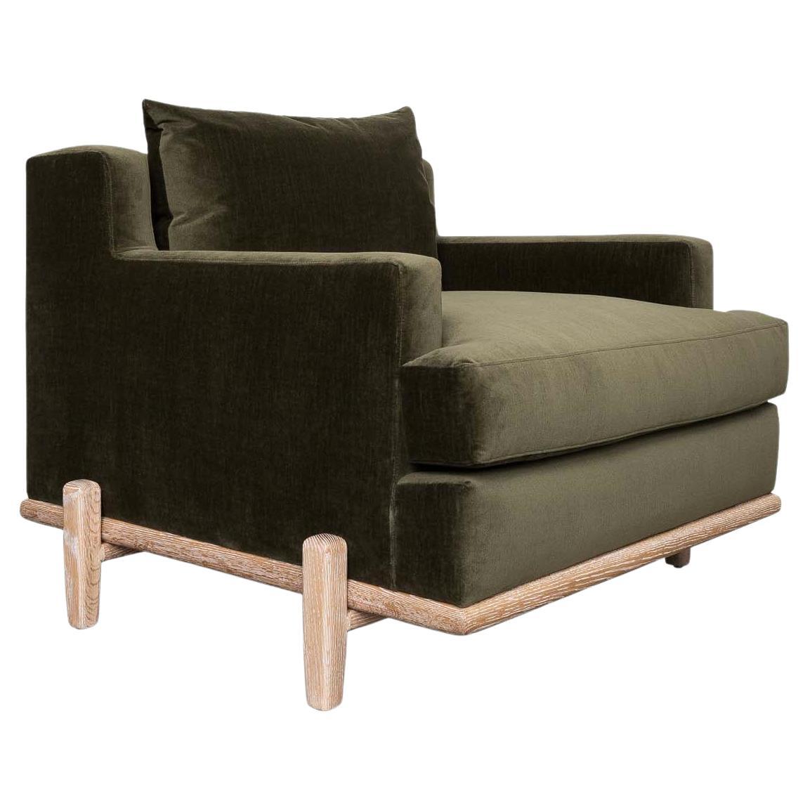 The George chair is part of the collaborative collection with interior designer Brian Paquette. The George Chair is a low profile, but wide-scale lounge chair that rests on top of a solid wood base. This piece is available in exclusive BP for LF