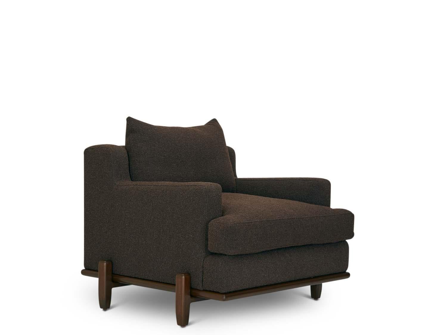 The George chair is part of the collaborative collection with interior designer Brian Paquette. The George Chair is a low profile, but wide-scale lounge chair that rests on top of a solid wood base. This piece is available in exclusive BP for LF