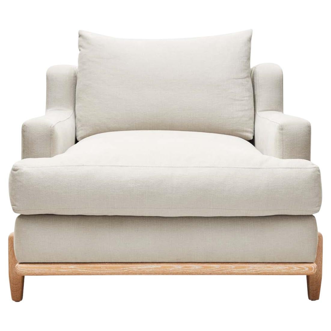 The George chair is part of the collaborative collection with interior designer Brian Paquette. The George Chair is a low profile, but wide-scale lounge chair that rests on top of a solid wood base. This piece is available in exclusive BP for LF