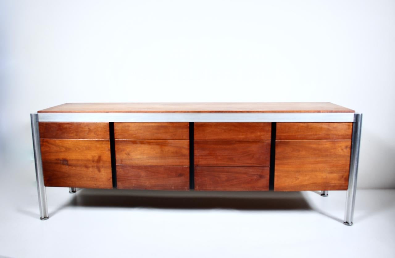 Georges Ciancimino for Jens Risom Walnut & Aluminum Quarefoil Credenza. Featuring a rectangular framework, Walnut veneered surface, strong Aluminum surround detailed with quadrilobed corner leg sections. Adjusting load leveling feet. Eight smooth
