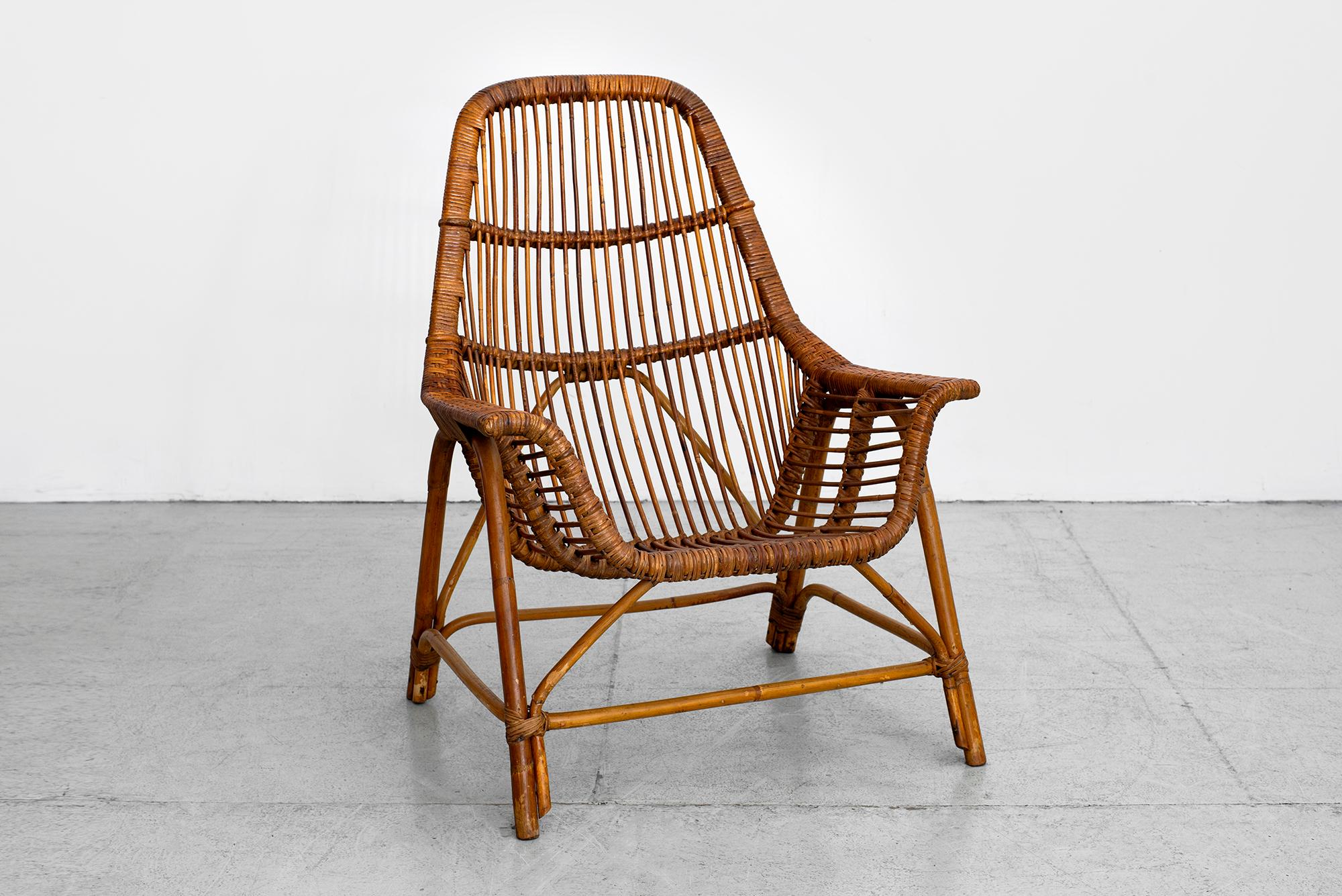 Wonderful single chair by Georges Coslin, France, circa 1956 
Rattan with sculptural shape.

   


   