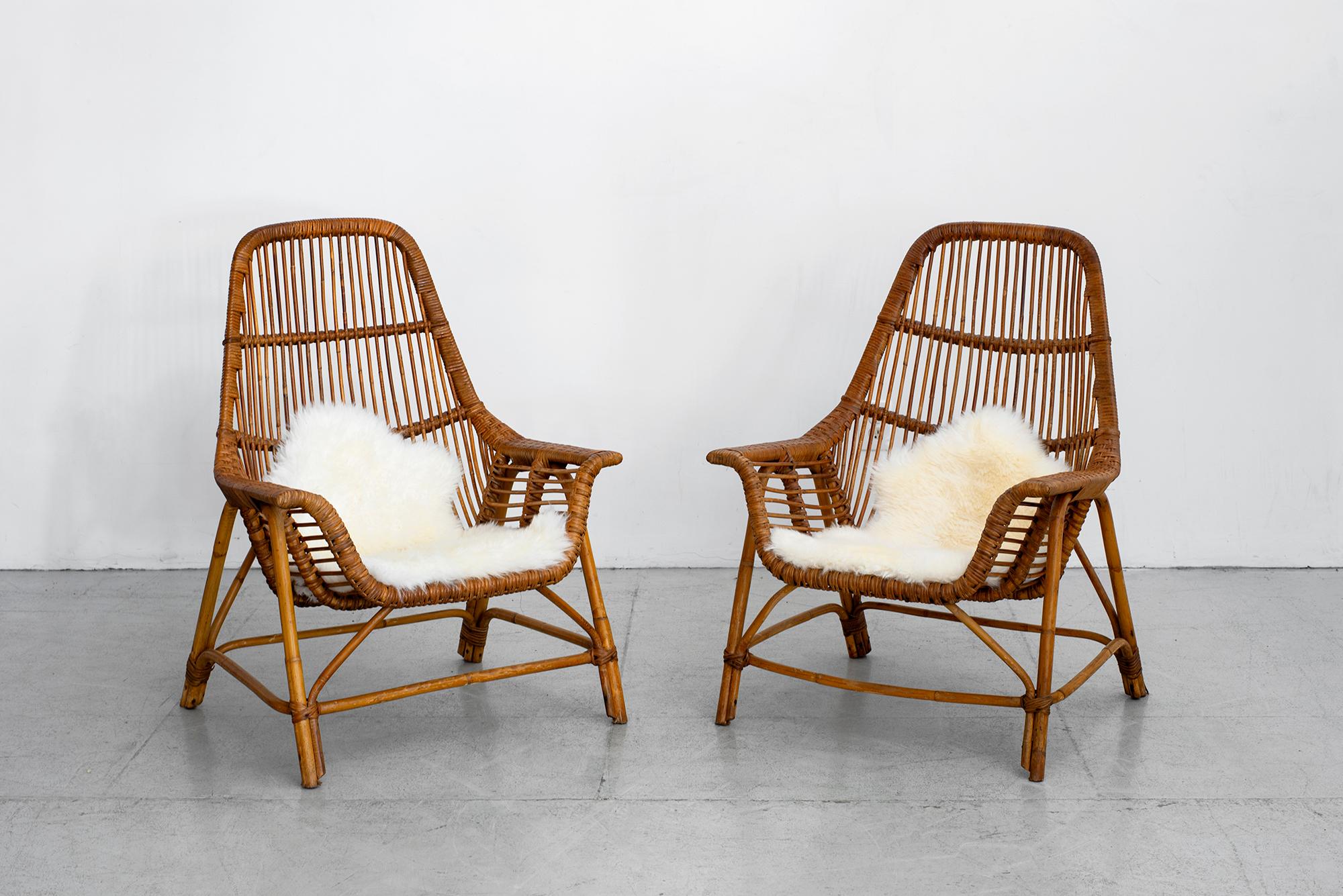 Wonderful pair of rattan chairs by Georges Coslin, France, circa 1956
Sculptural scoop shape.




