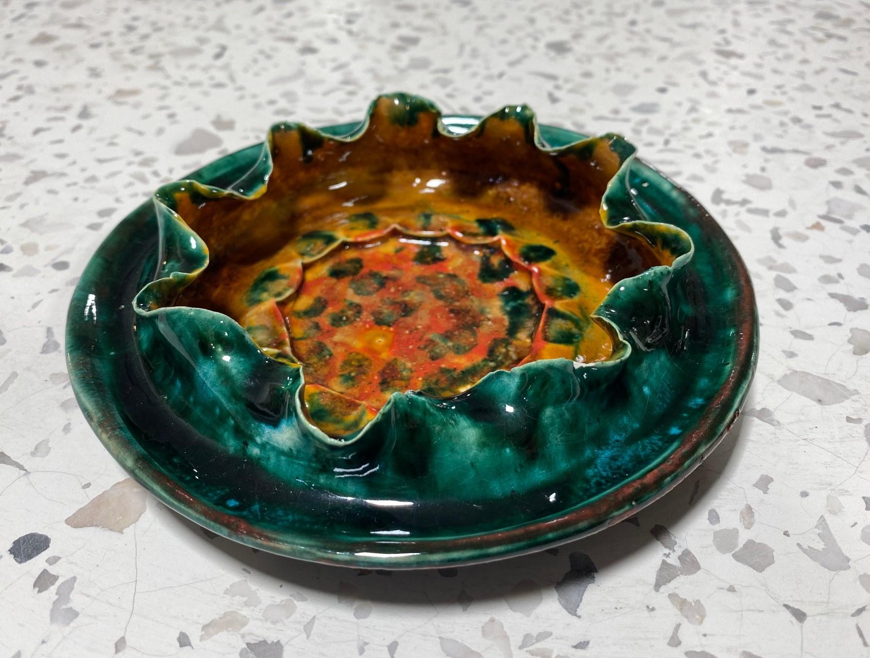 A wonderfully designed and glazed bowl by renowned American/ Mississippian potter George E. Ohr. ( or as he famously referred to himself as the 