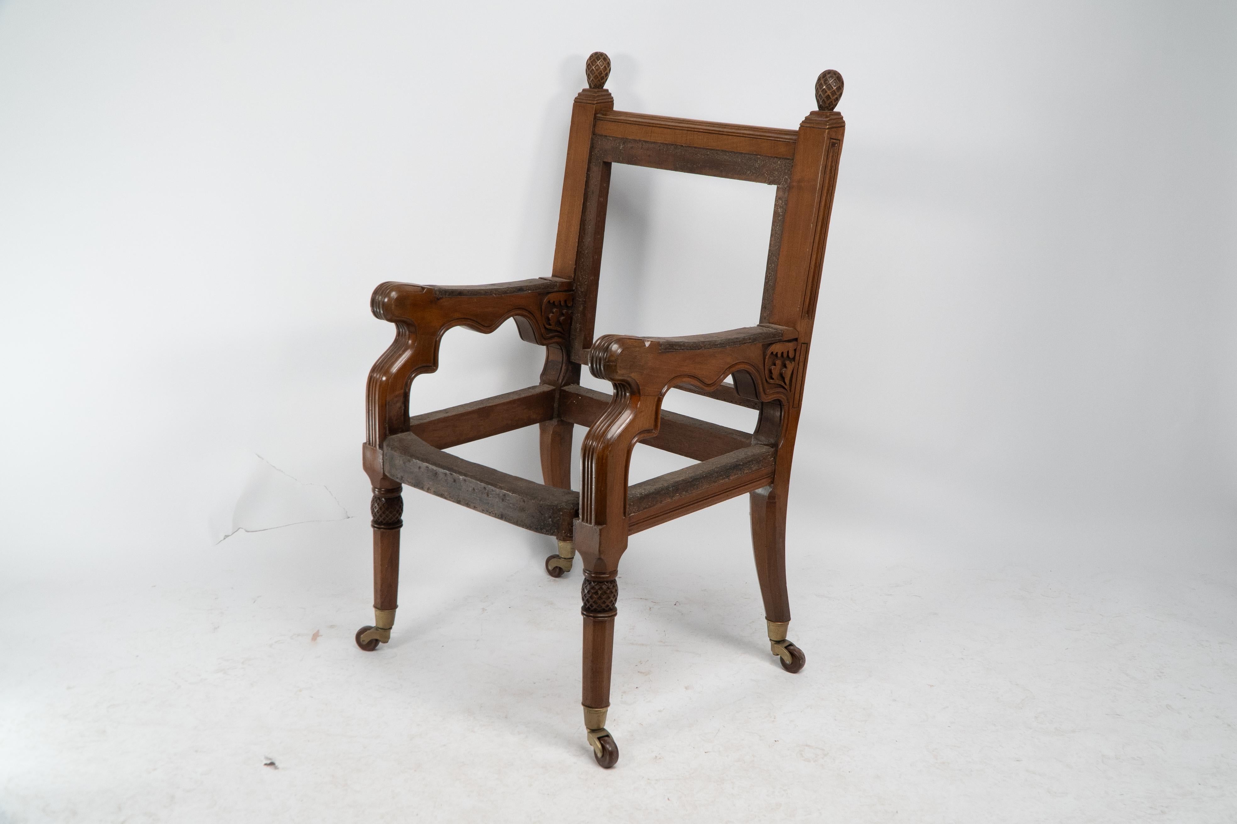George Edmund Street. A Gothic Revival walnut armchair, designed for the Judges for The Royal Courts of Justice in Fleet St (London's High Court). With spiral carved finials and further spiral carving to the front legs. With a subtle flowing design