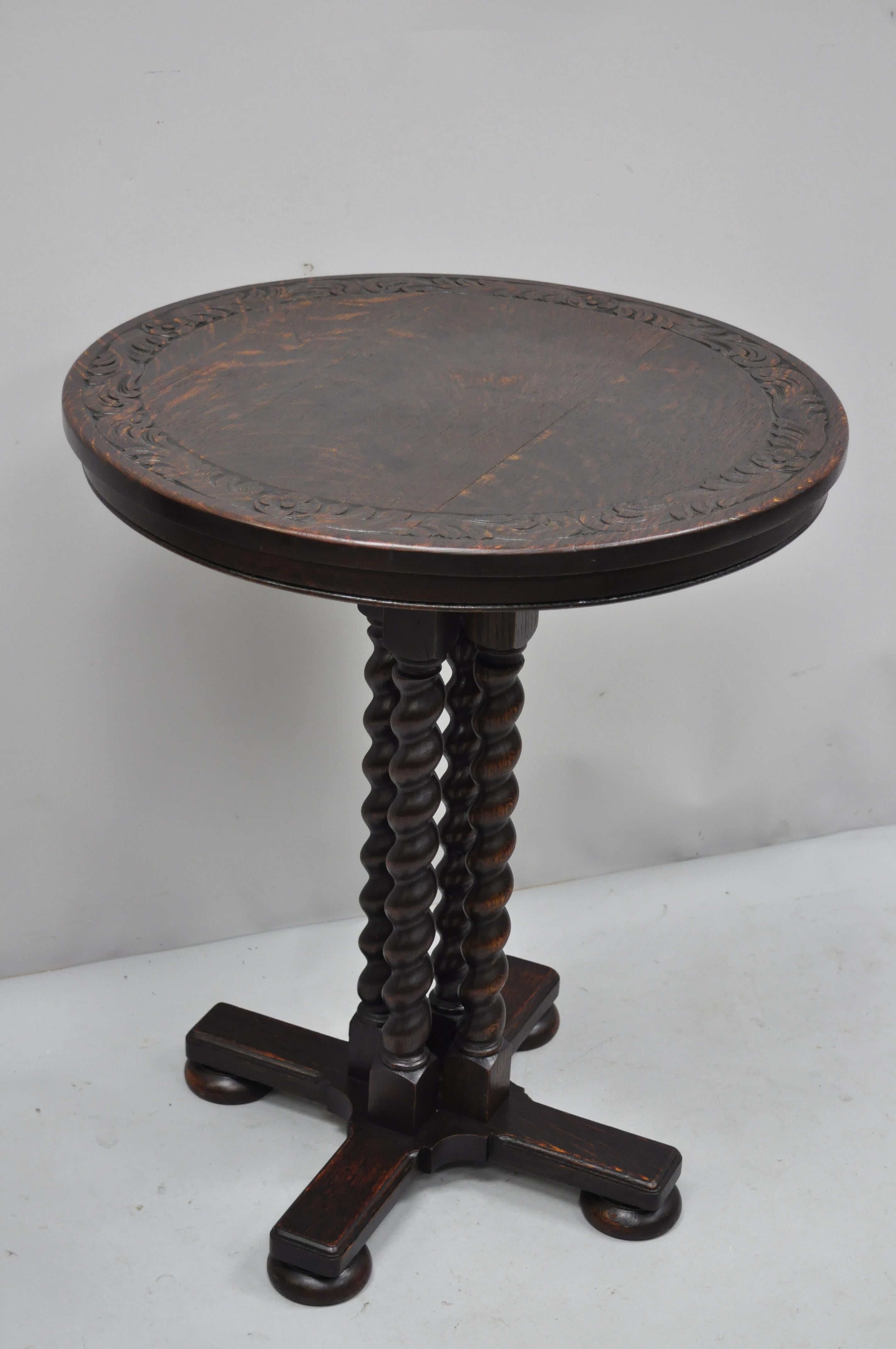 George Flint Oak Spiral Carved Barley Twist Jacobean Round Center Table. Item features pedestal base with four barley twist spiral carved supports, bun feet, carved border to top, solid wood construction, beautiful wood grain, original label, very