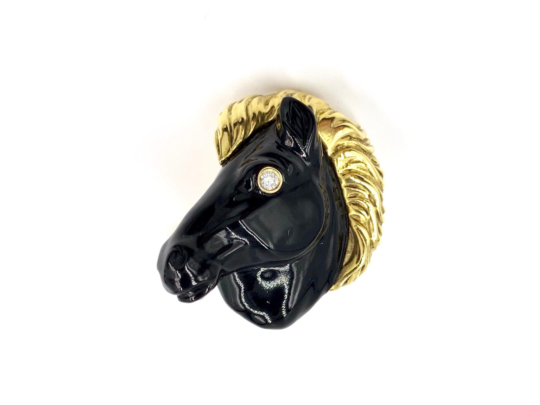 Handsome statement 18 karat horse head cuff links, expertly crafted by George Gero. Each cuff link features a detailed and smooth carved onyx horse head with a yellow gold flowing mane and a single round diamond eye. Diamond total weight is .06