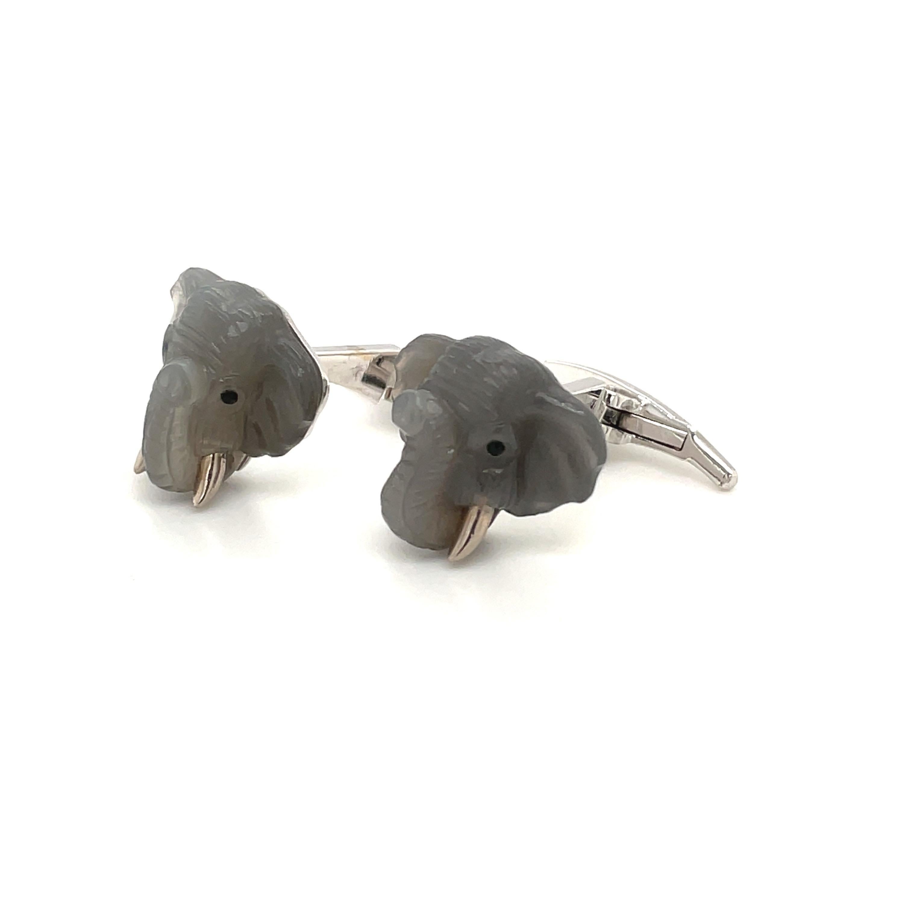 Created by Michael Kanners, renowned worldwide for luxurious men's cuff-links, comes these whimsical and wearable unique pair. These lucky elephant head cuff links are beautifully crafted with hand carved grey moonstone, and blue sapphire eyes. The