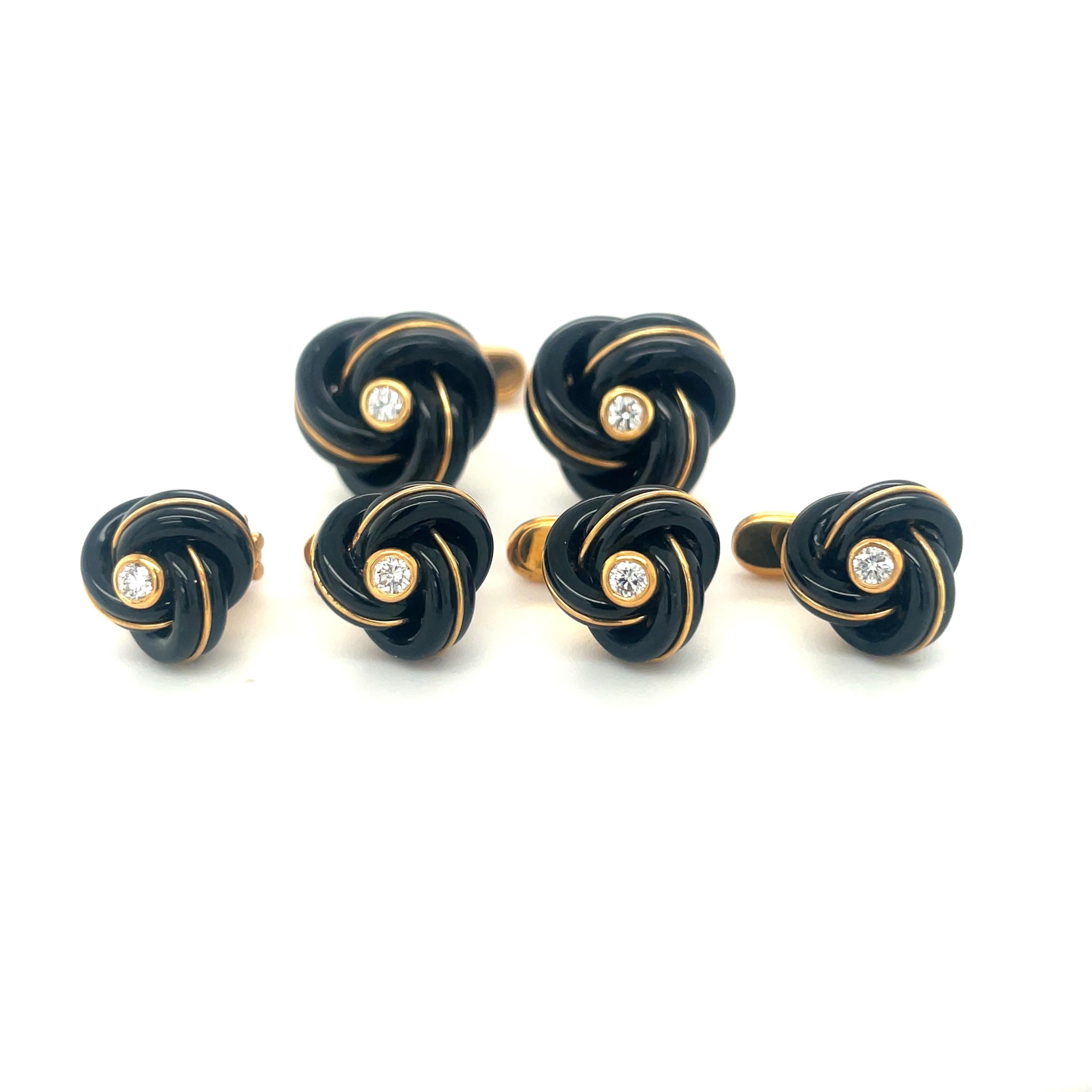 Created by George Gero, renowned worldwide for luxurious men's cuff-links, comes this classic cuff-links /studs dress set in 18 karat yellow gold. The black onyx knot cuff links / studs are detailed with yellow gold and have bezel set diamond