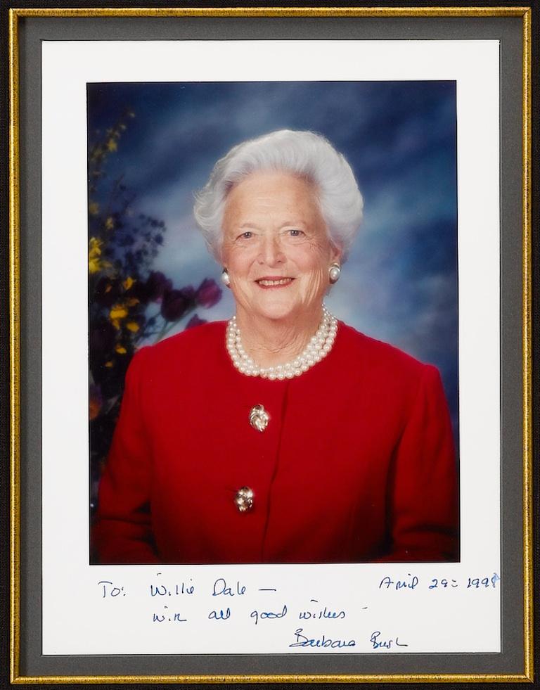 This is a handsome collage of two signed and inscribed photographs of George H. W. Bush and Barbara Bush. 

Both photographs are inscribed to the same recipient, Willie Dale. The portrait of George H. W. Bush standing along the seashore in Maine is