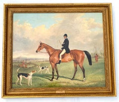 Fox Huntsman seated on a Bay horse, with hounds in an English landscape.