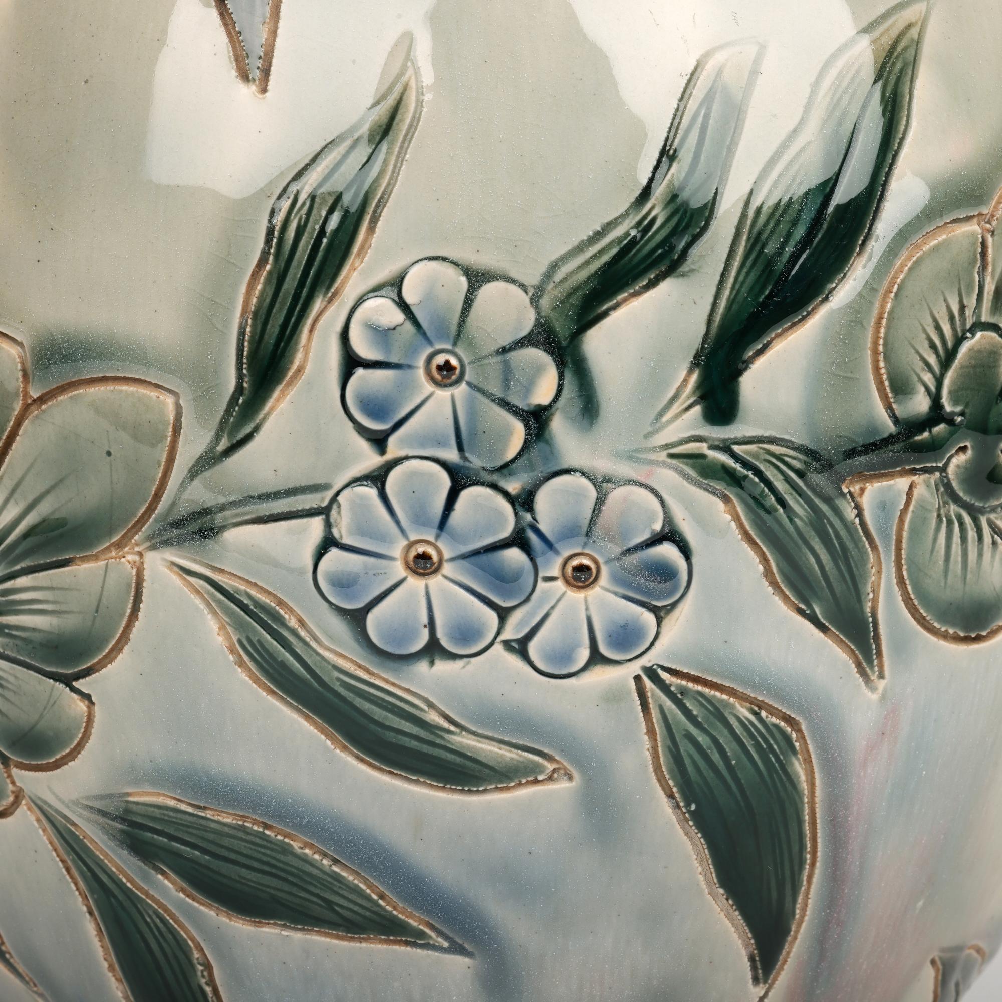 A stunning and rare pair Doulton Lambeth aesthetic movement vases decorated with foliate designs by renowned and sought after potter George Hugo Tabor dated 1881. 

George Hugo Tabor joined Doulton Lambeth in 1881 and only spent eight years at