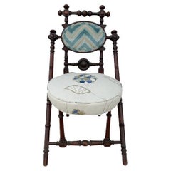 George Hunziger patent 1869 walnut chair with newer crewel upholstery