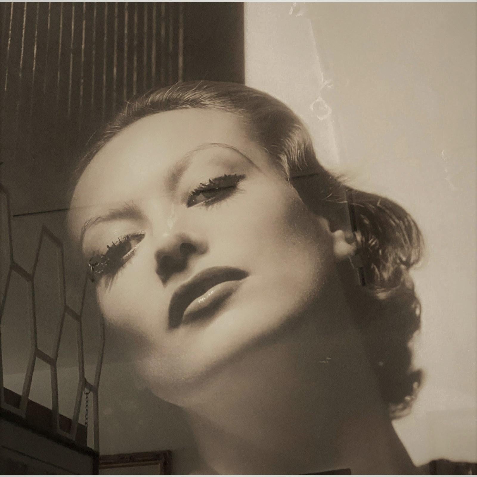 This large scale photograph of the iconic, Hollywood movie star Joan Crawford was originally taken in 1932 by George Hurrell. This image depicts Crawford in the on-screen role as Letty Lynton, .a torrid love story and suspense drama based on a novel