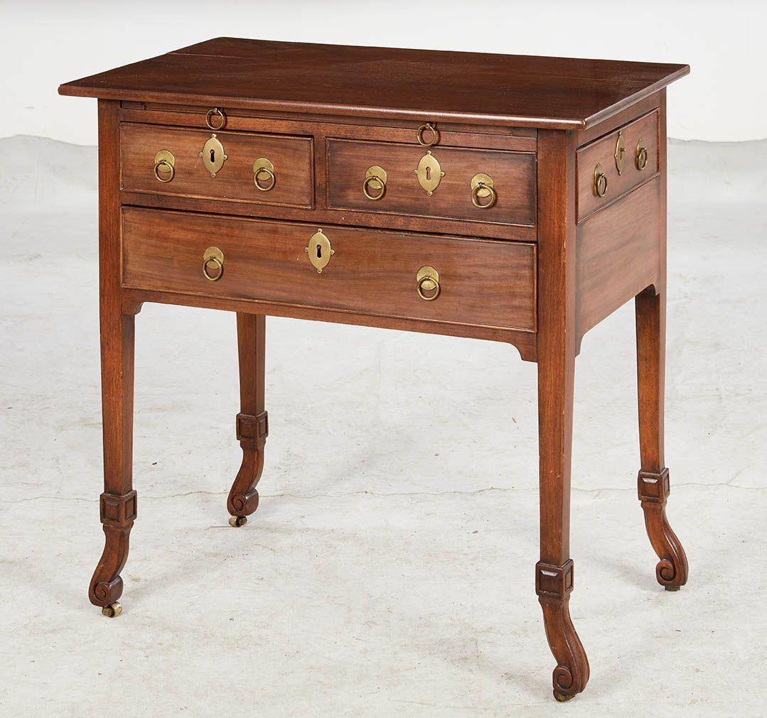 Exceptional George I mahogany gentleman's dressing table or desk, the rectangular eased corner top over an ingenious arrangement of useful working and false drawers to front and one side, and including a brushing/writing slide, standing on square