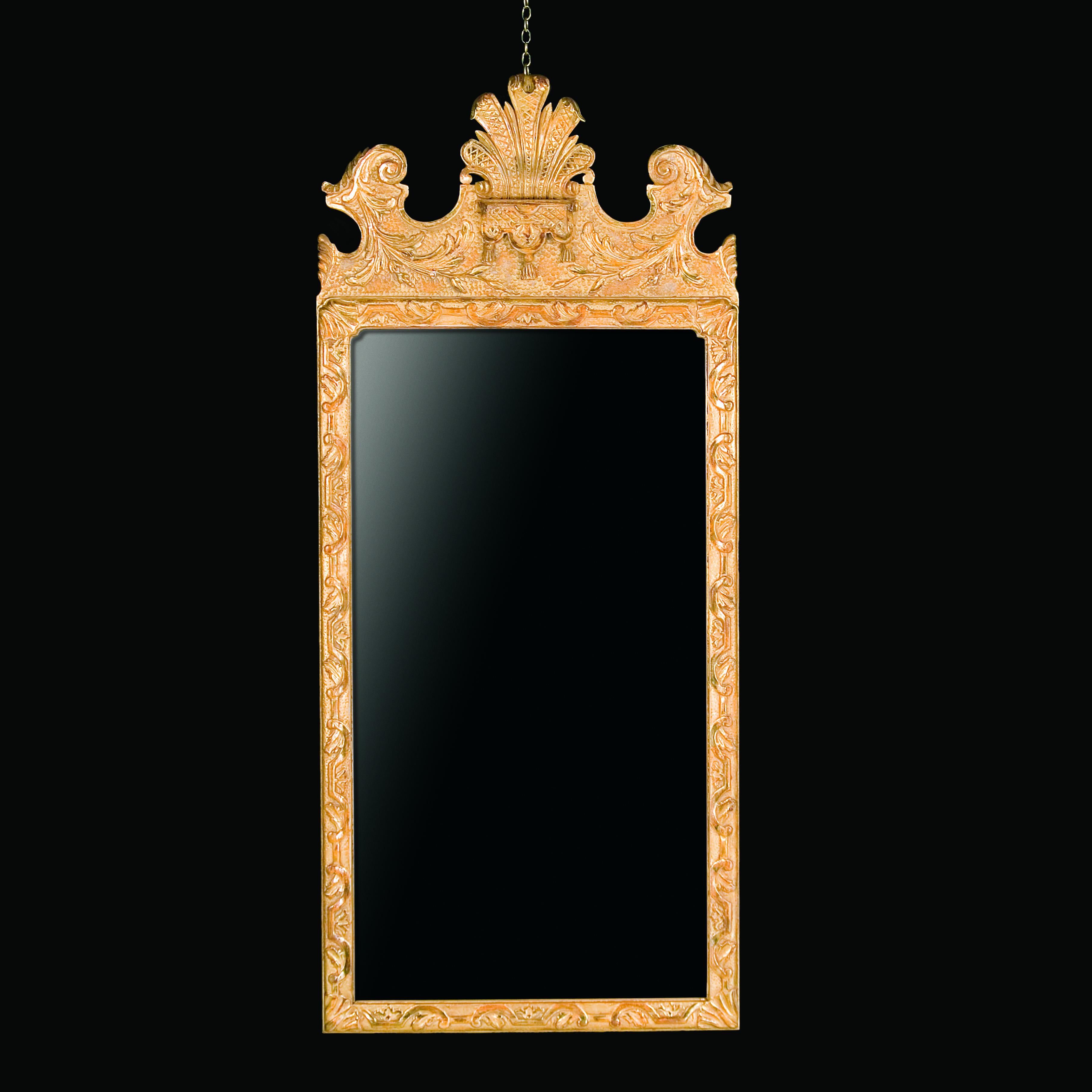 The oblong mirror plate is within a moulded frame carved with interlaced strapwork and leaves on a punched ground.

Bespoke sizing, design adaptations and finishing available.

We are currently working to a 30-36 week lead time.