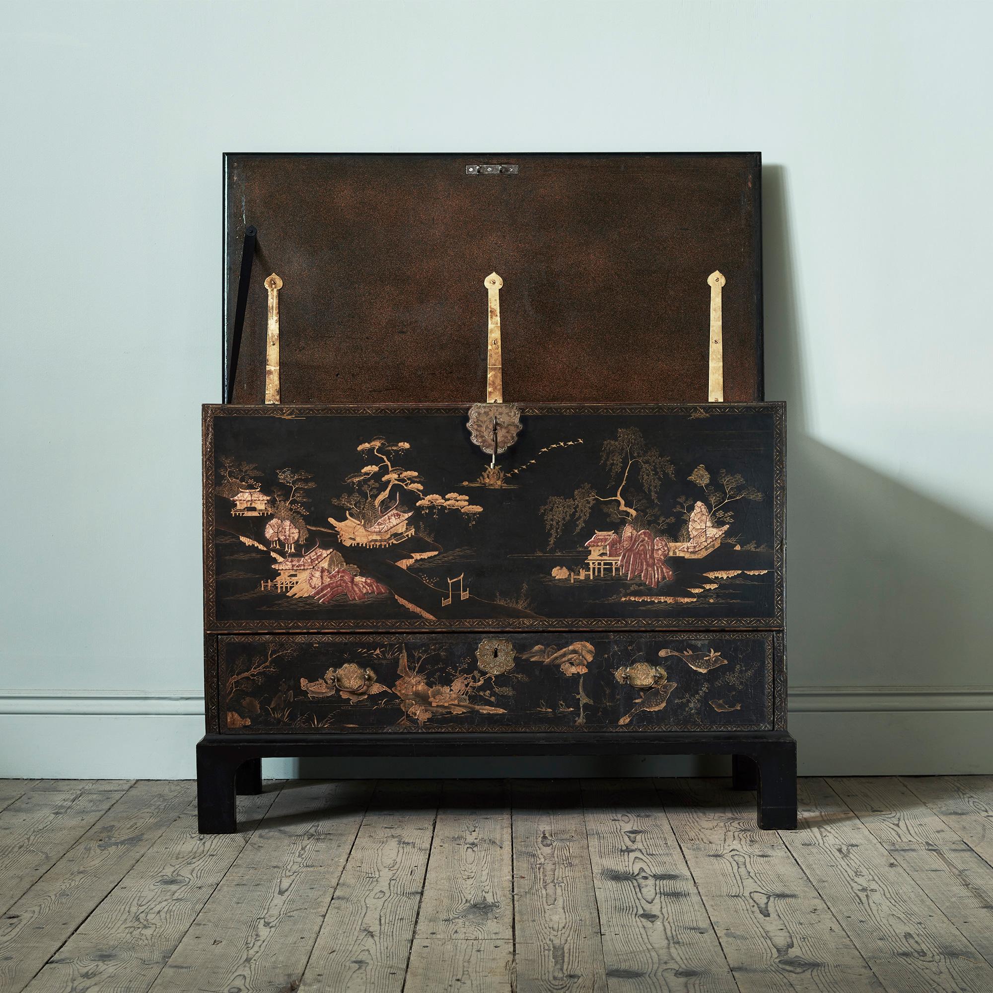 A George I Lacquered Chest

A chest of archetypal form and confident proportion, raised on bracket feet. The detailed decoration features figures in silk robes, trees and the sleek forms of flying birds, picked out from the dry, sleepy Urushi 漆