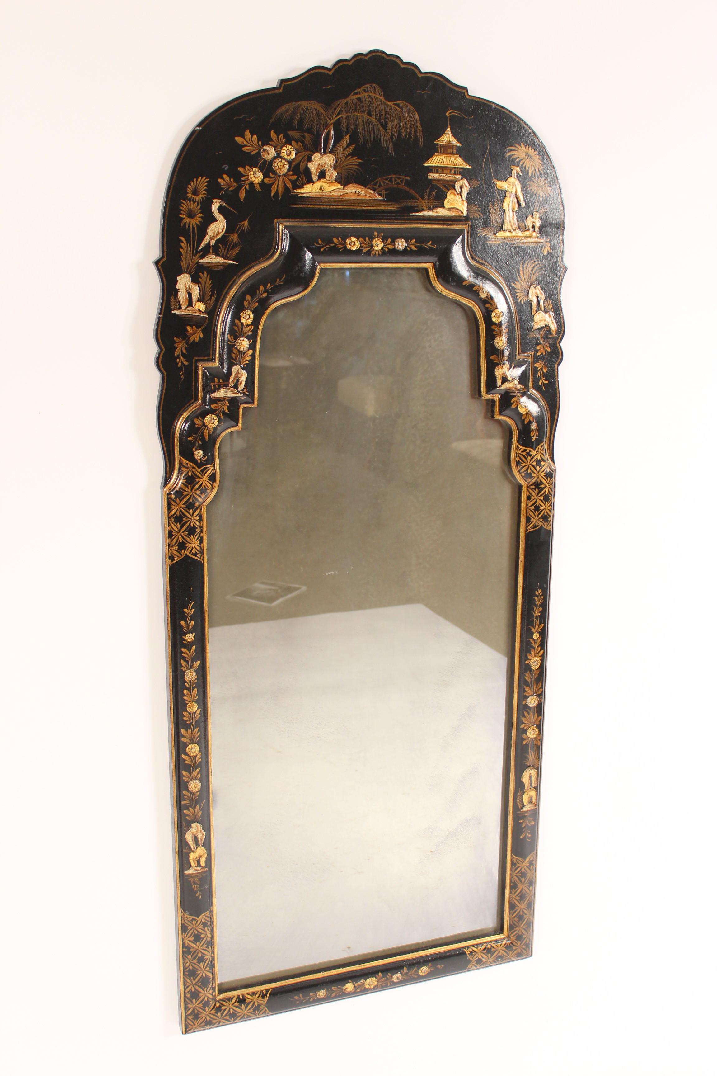 George I style black chinoiserie decorated mirror, late 20th century. With raised chinoiserie decorations.