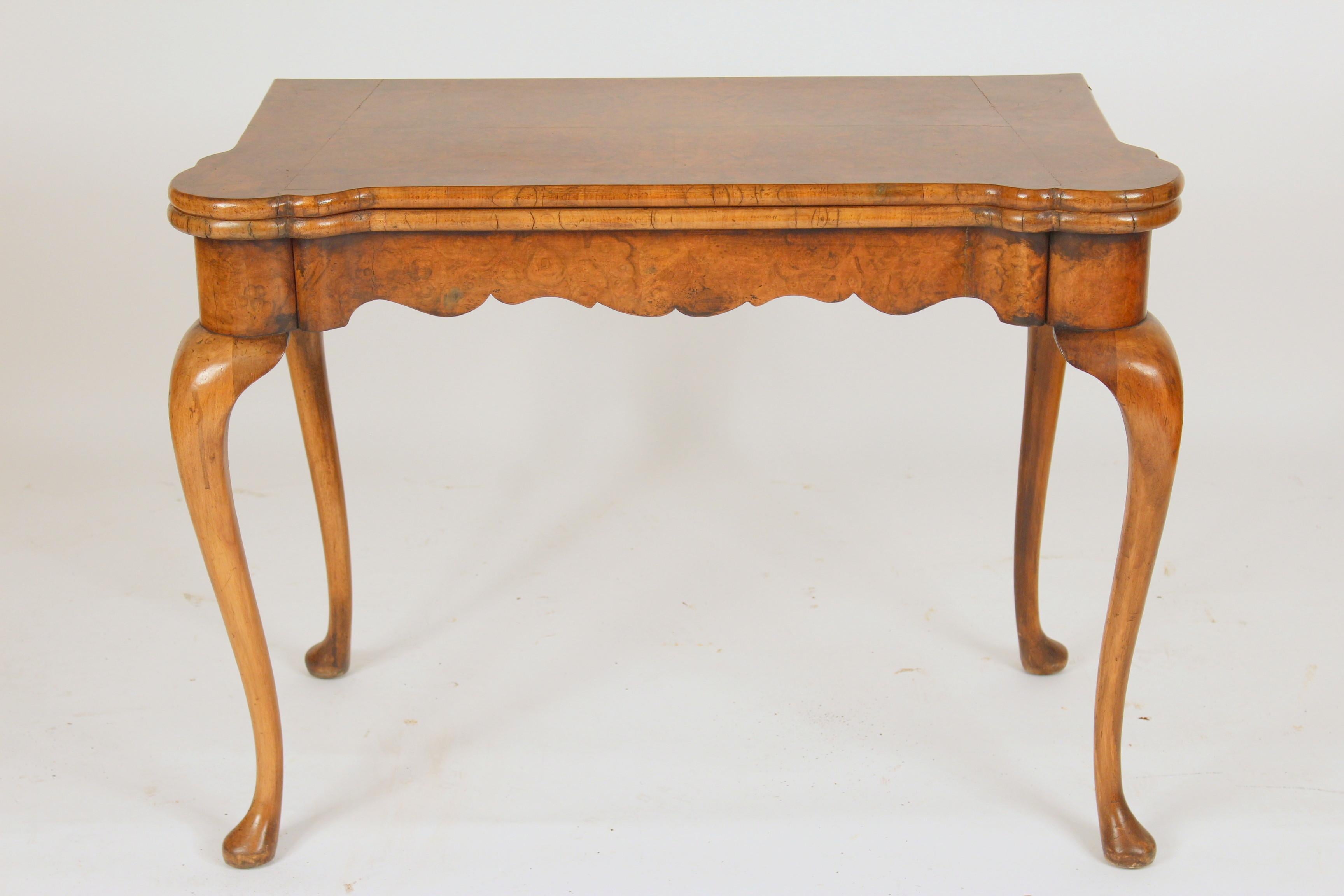 George I style burl elm and walnut ? Concertina action games table with a suede playing surface, turret corners and wells for gaming chips, circa 1920-1940. Dimensions when gaming surface is opened 40.75