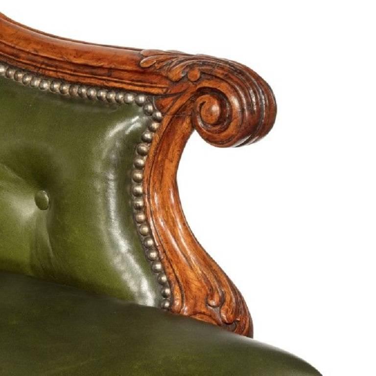 A George I walnut armchair of generous proportions, re-upholstered in distressed green leather, English, circa 1720. 

Measures: Seat depth 20in, width 28in.