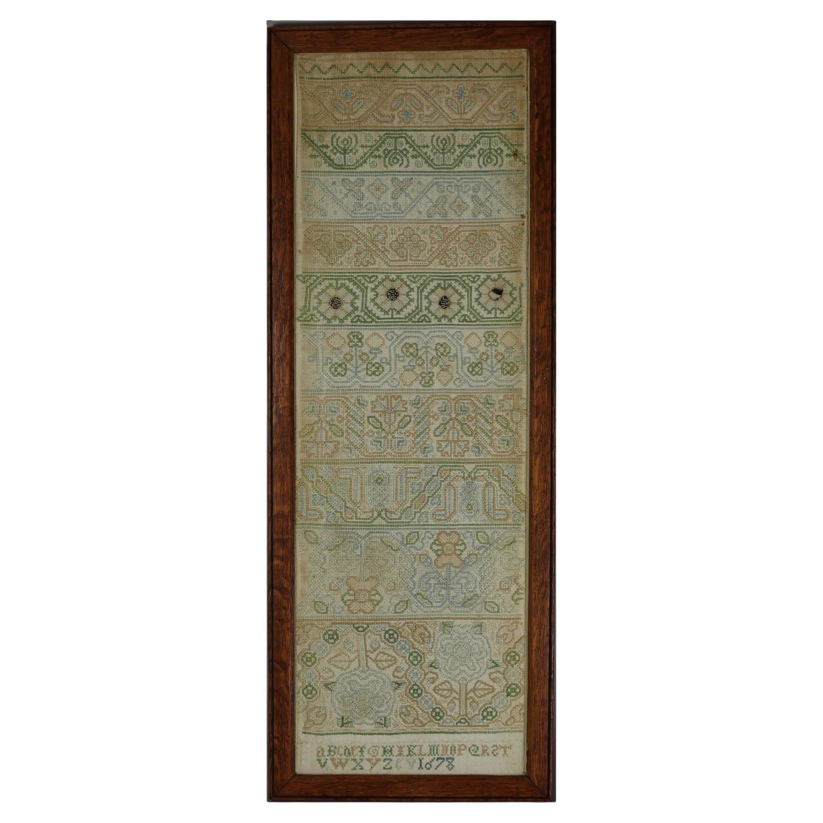 George II Band Sampler, daté de 1678, cousu par EV