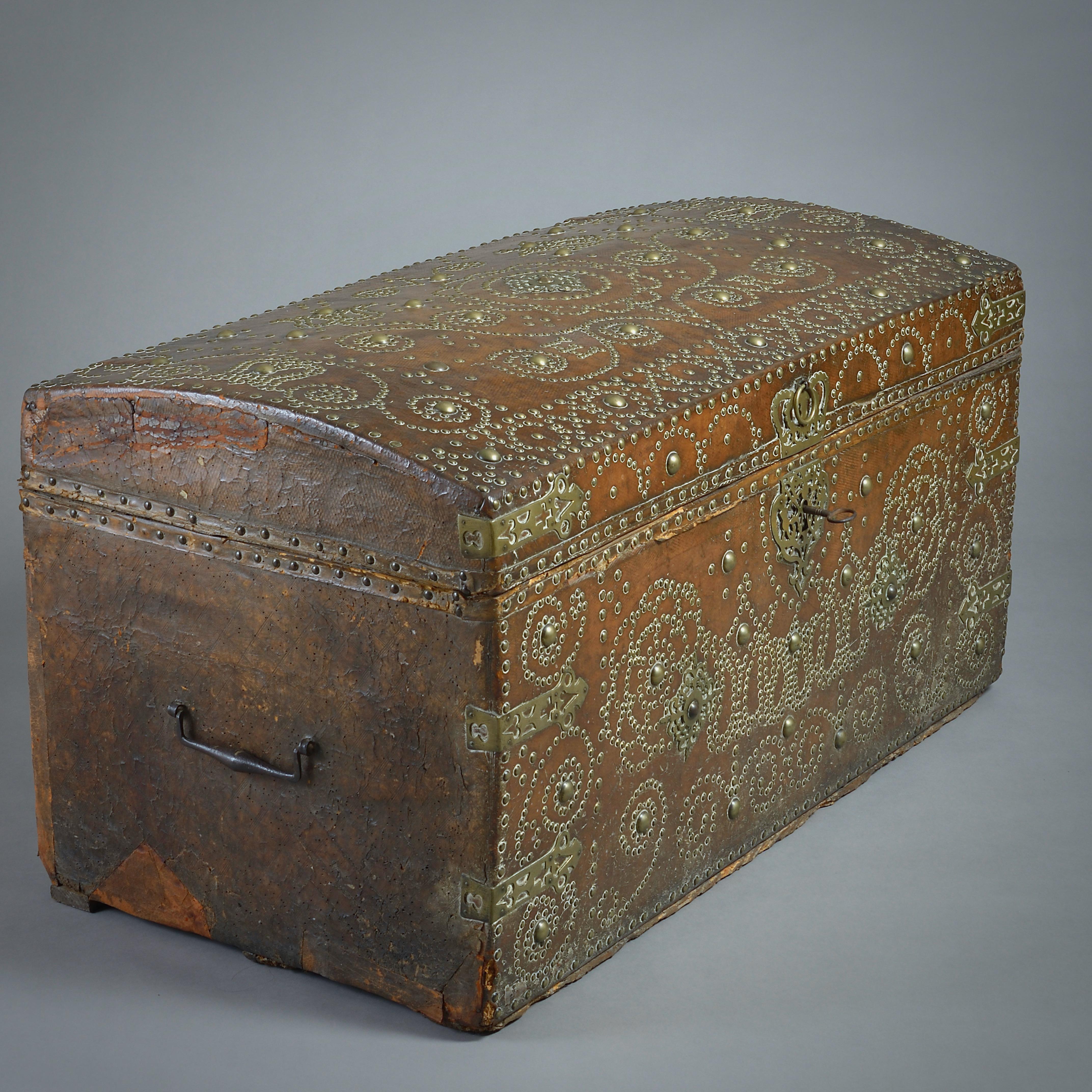 A FINE GEORGE II BRASS-STUDDED LEATHER TRUNK BY HENRY NICKLES, CIRCA 1730.

Geometrically decorated with brass studs, a crown, and a pierced lock plate. Initialled ER. The interior with original marbled paper labelled Henry Nickles Trunk-Maker at ye