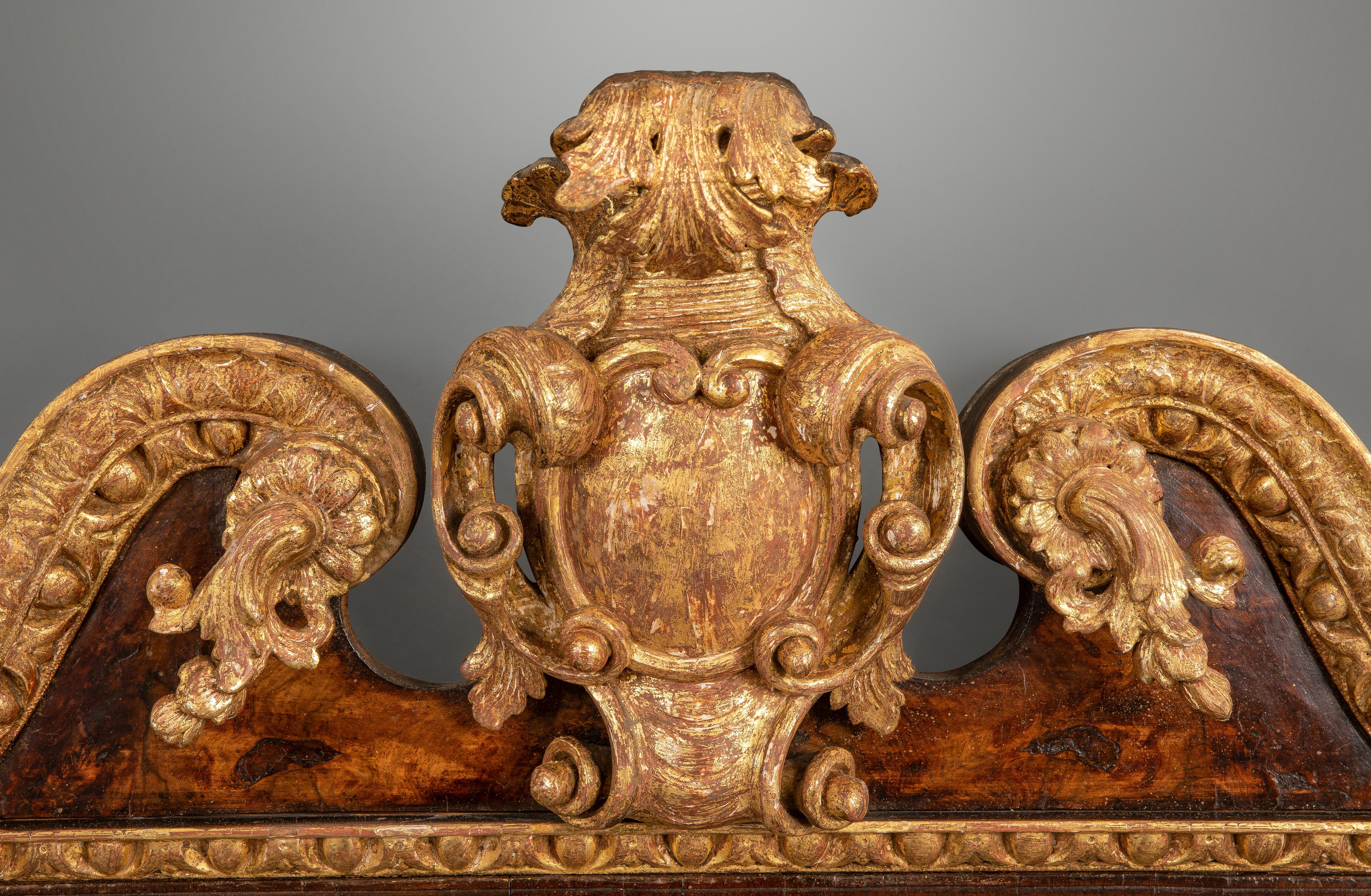 This mirror is of very high quality with beautifully figured walnut and an exceptional quality swans neck cresting, with foliate attachments centered by an acanthus and C-scrolled carved cartouche of unusual depth. The sides with gilt pendant