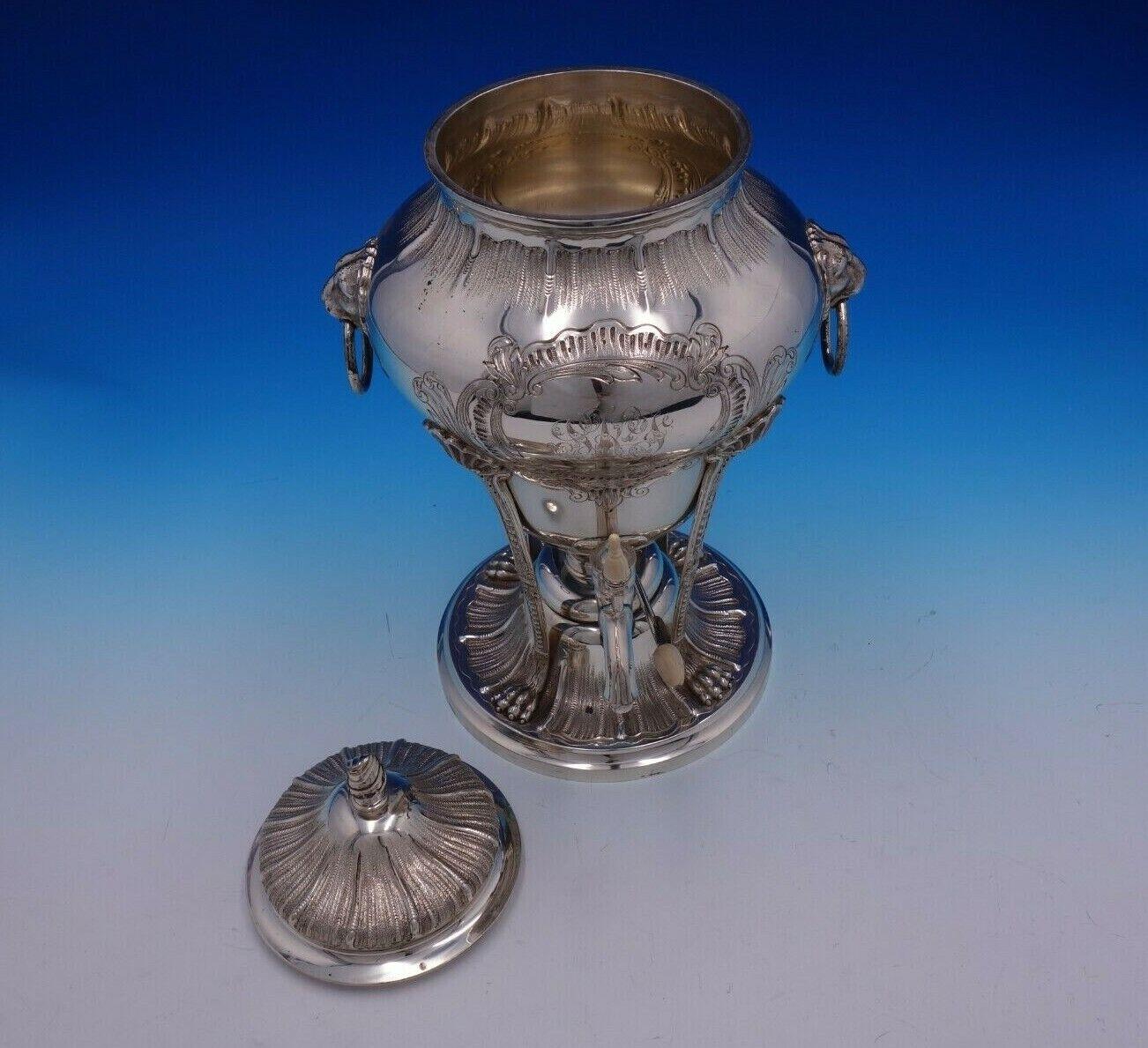 eorge II by Tuttle

Exceptional George II by Tuttle sterling silver chased coffee urn with lion handles and paws marked #435. This piece measures 14