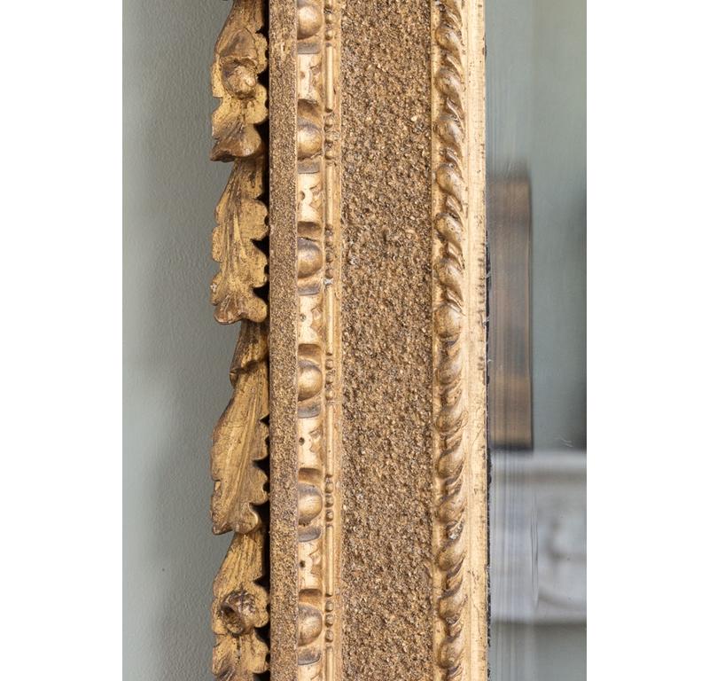 A George II Carved Giltwood Kit-Kat Frame Wall Mirror.

Additional information:
Dimension: Height: 82 cm, 32 1/4″
Width: 67 cm, 26 3/8″