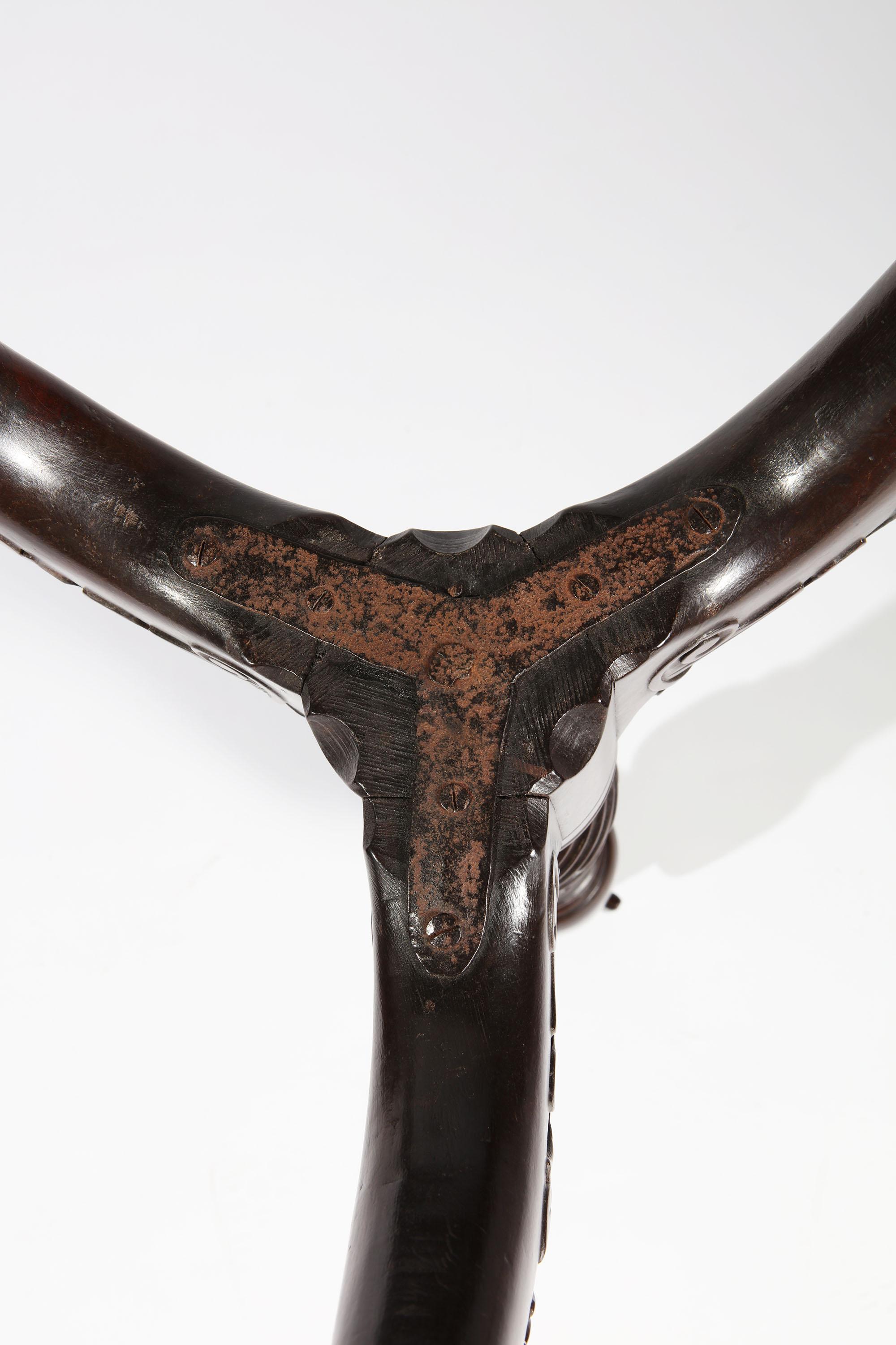 A fine mid-18th-century mahogany tripod table with rare square top with carved rope detail to the sides supported on a birdcage tilt-top mechanism with original circular brass catch, the top raised on a tripod base with fluted column and outswept