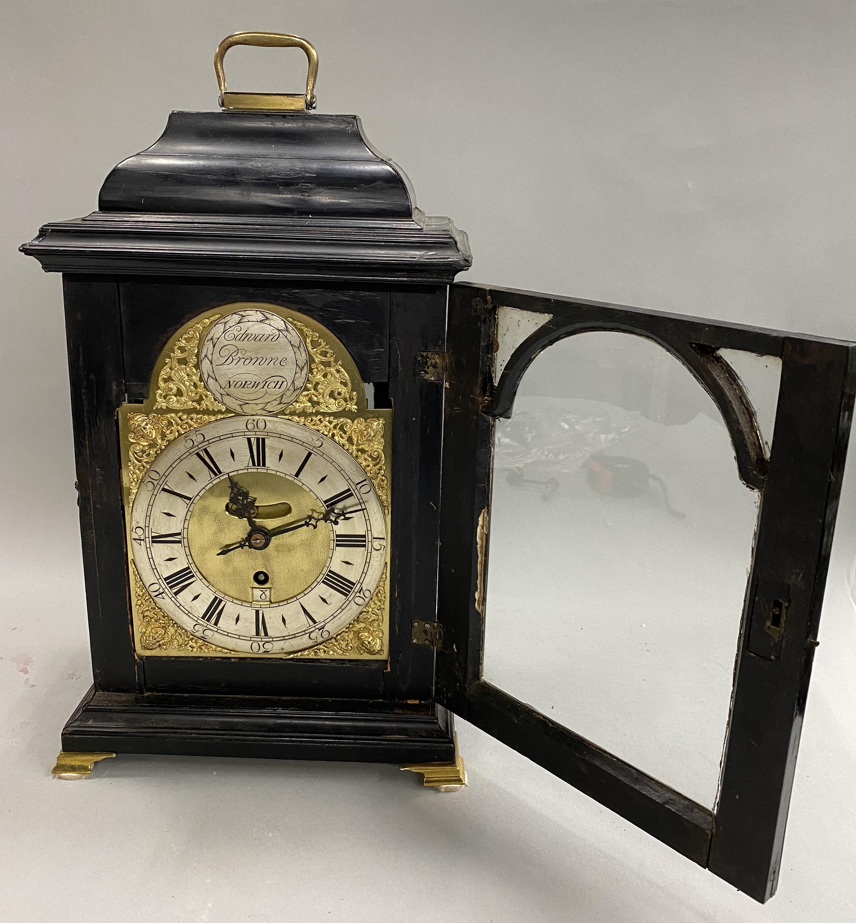 A nice example of a George II bracket clock in an ebonized mahogany case with brass feet made by clockmaker Edward Browne of Norwich. Edward Browne took over the shop of clockmaker Jeremah Hartley in the Market Place, Norwich after Hartley's death