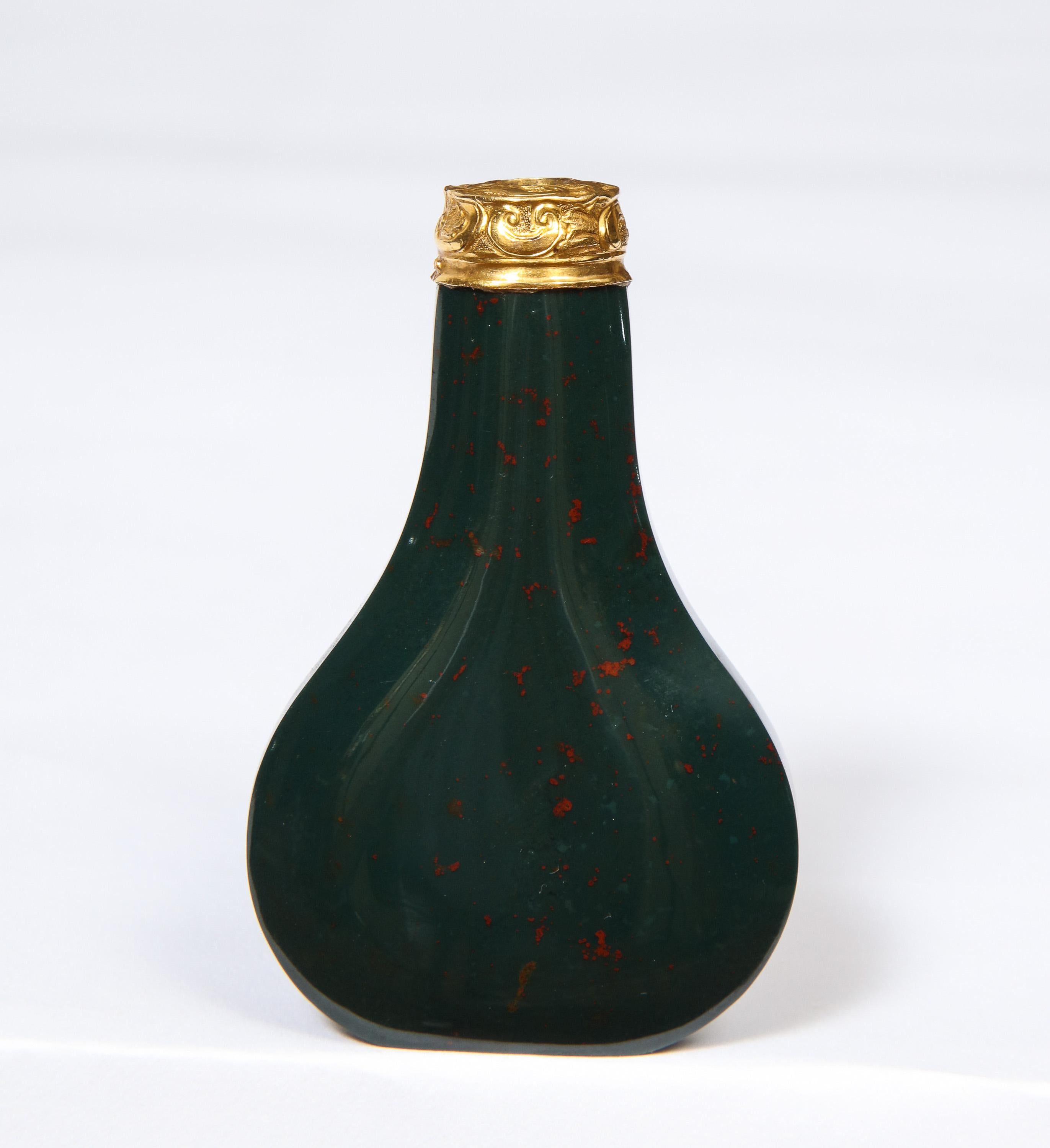 George II English 18-karat gold and bloodstone perfume bottle, circa 1760.

Good quality and good condition, lacking stopper.

Measures: 2.5