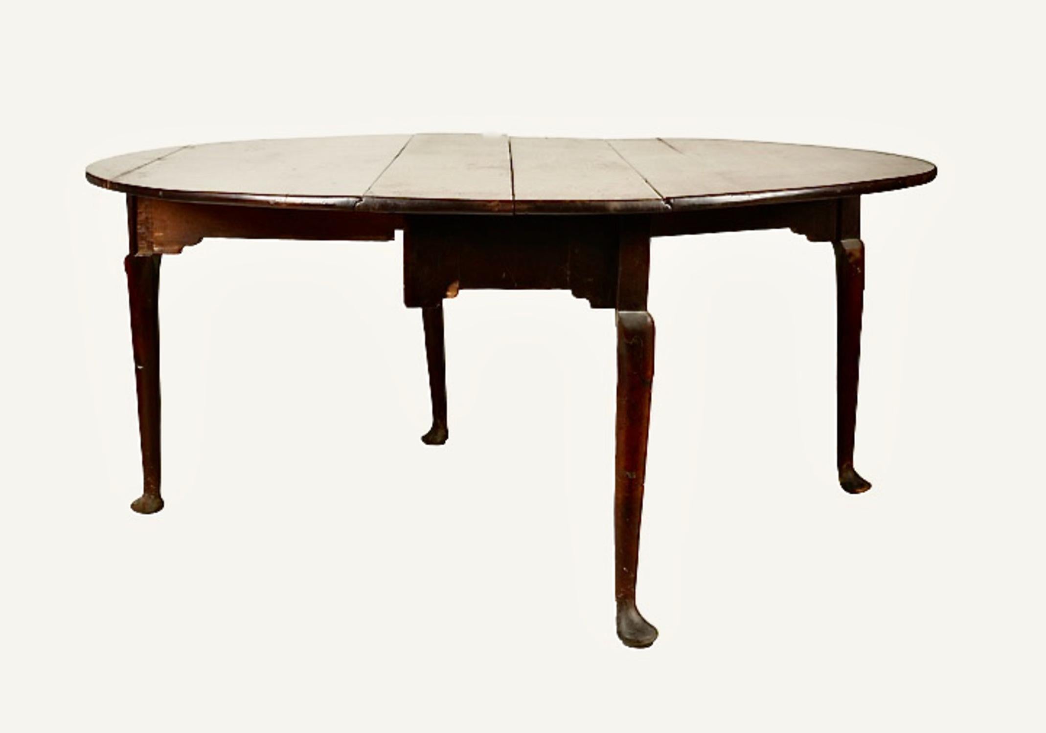 This is a stunning George II c. 1730 - 1740 solid Oak Gateleg/Drop Leaf Dining Table. The table was created nearly 300 years ago during the reign of George II (1727 - 1760). The table seems to be completely original, including its old surface. The