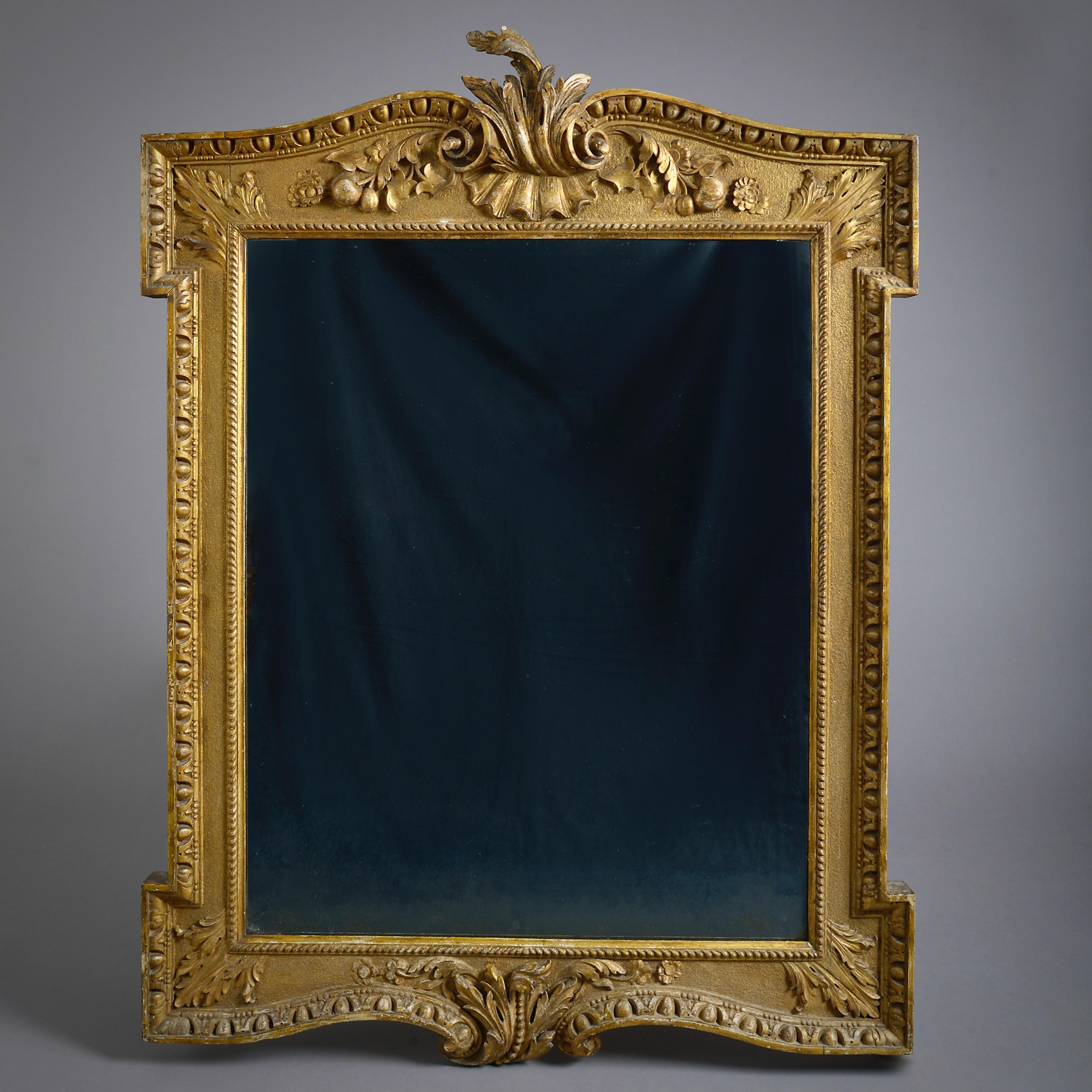 A fine George II gilt-wood mirror in the manner of William Kent, circa 1740.

With original gilding, the plate a 19th century replacement.