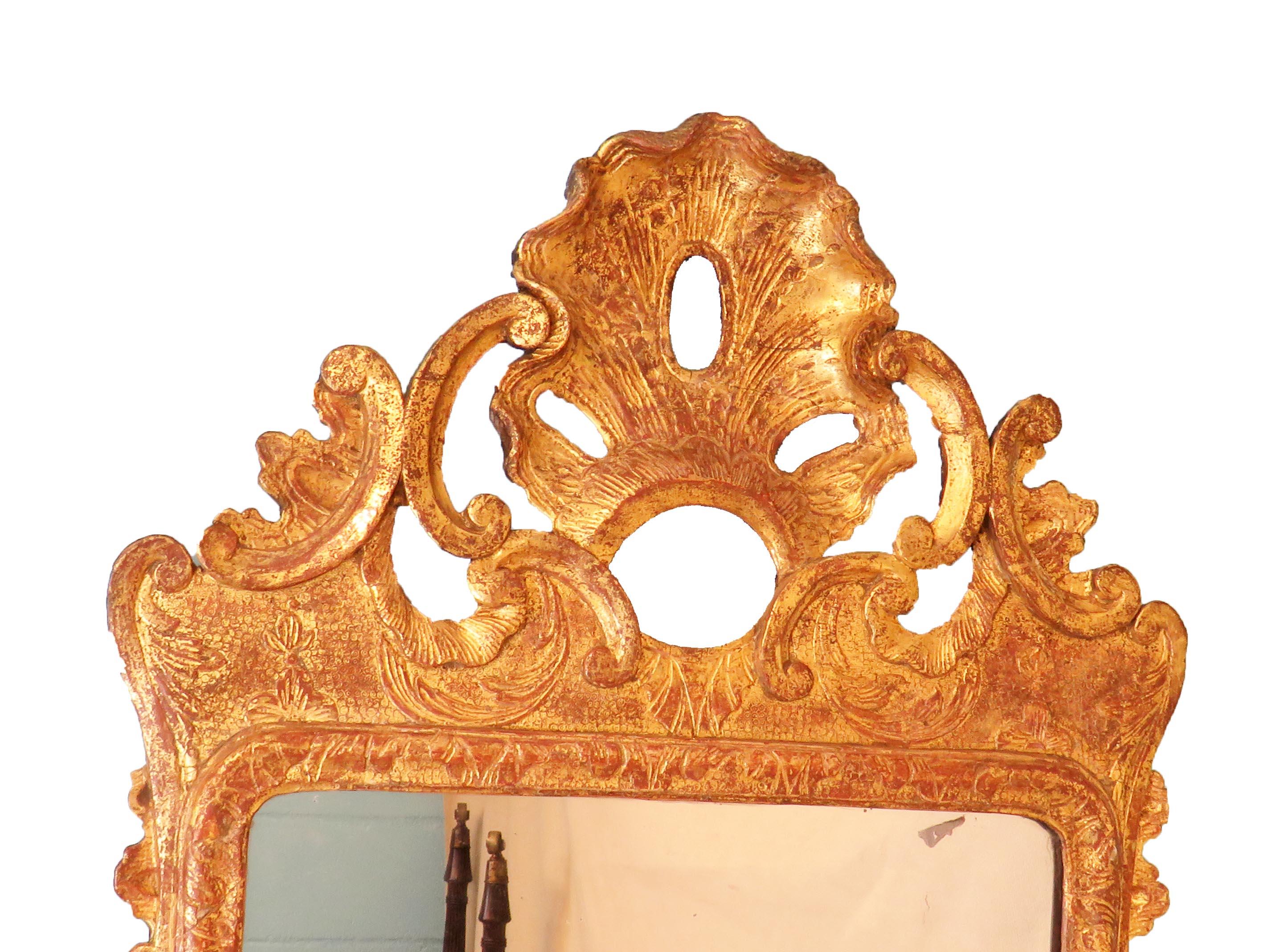 A Delightful 18th Century George II Period Giltwood 
And Gesso Wall Mirror Having Attractive Open Carved
Shell Flanked By C Scrolls Surmount Above Replacement 
Rectangular Mirror Plate Surrounded By Elegant Foliate 
Carved Strapwork Frame

( This