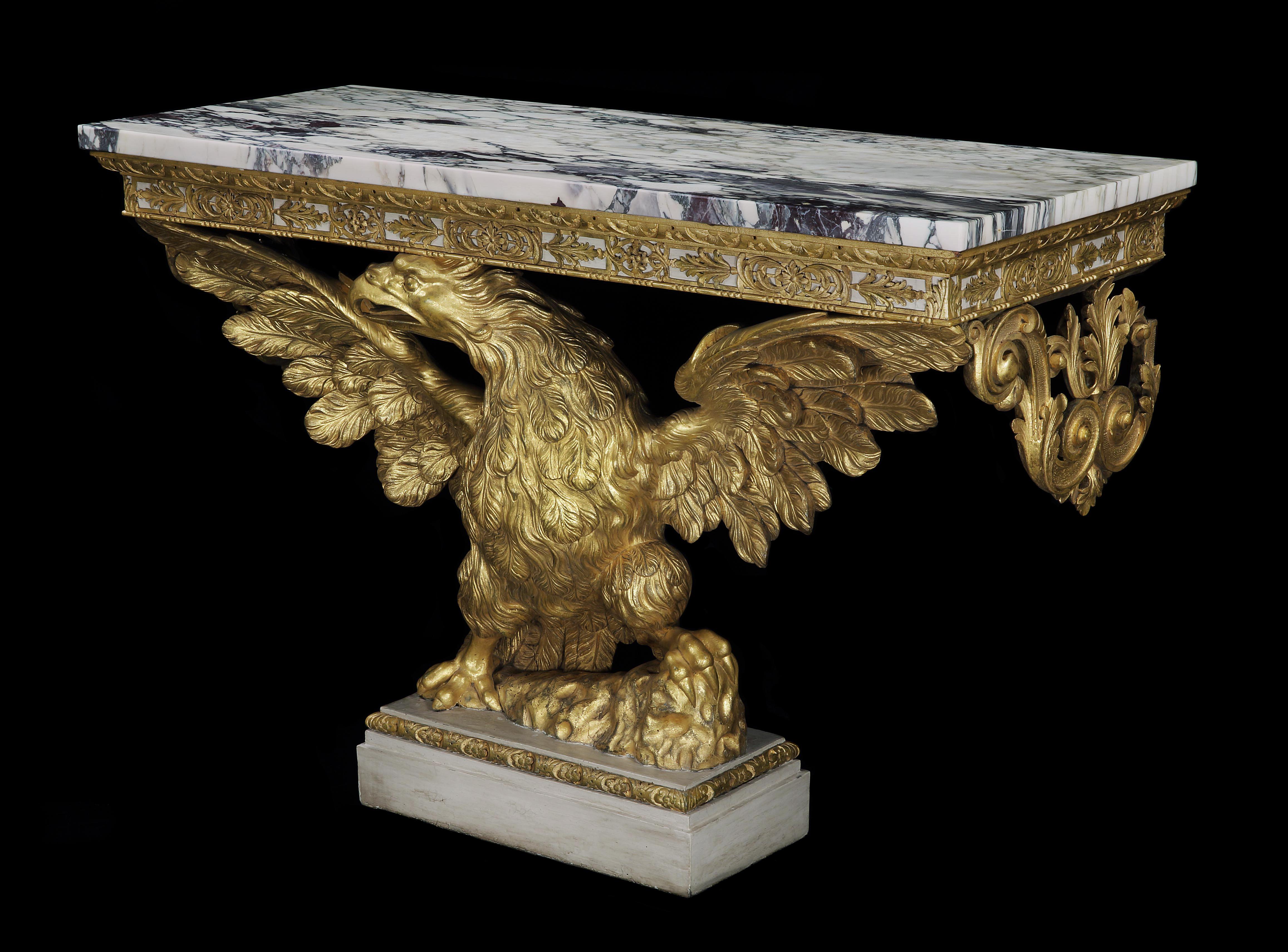 An exceptional and beautifully proportioned George II carved giltwood console table, the 'Carrara Brescia' marble top above a frieze carved with acanthus leaves, supported by a eagle with elegant out stretched wings standing on rockwork.

English,