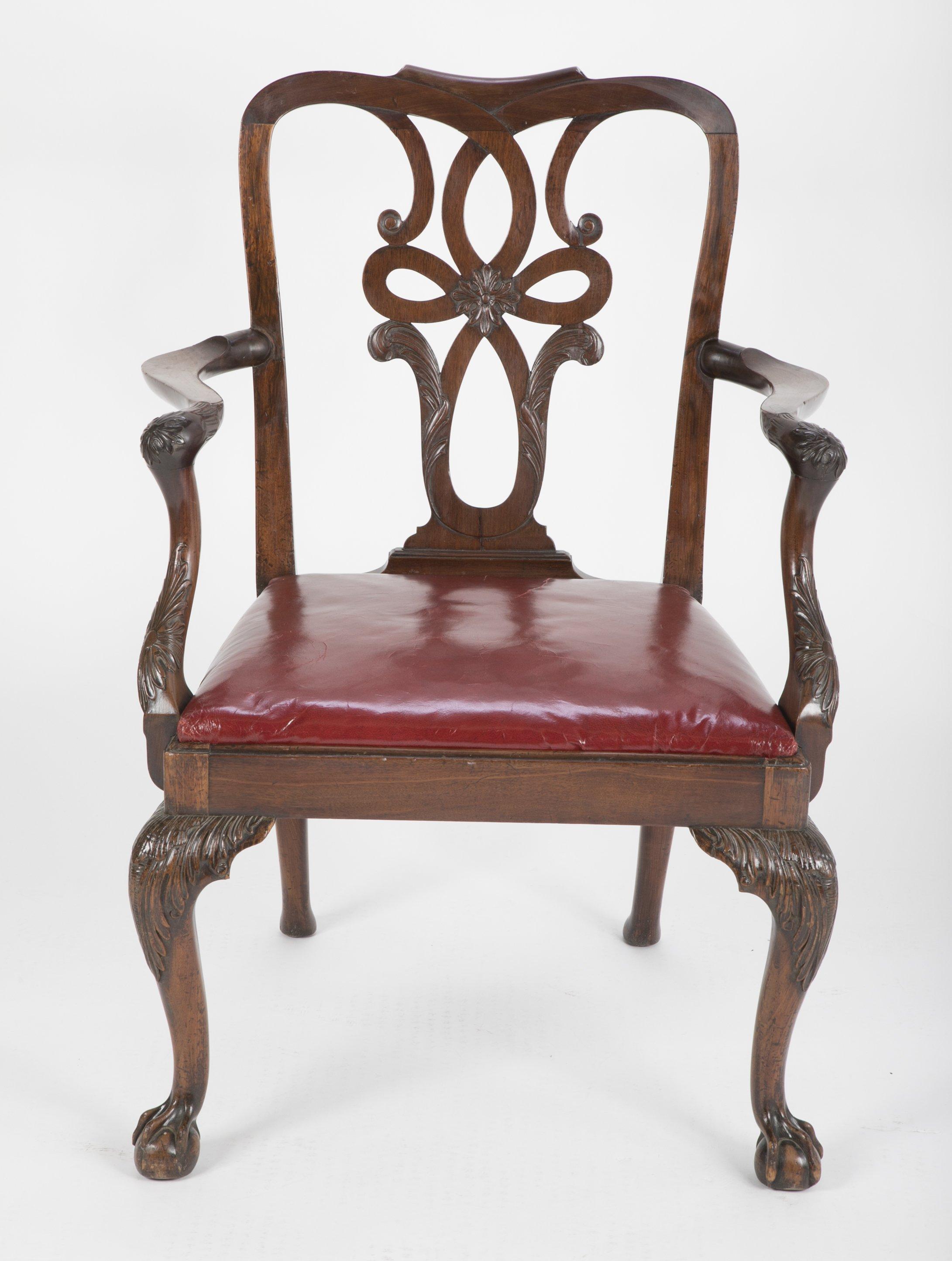 An English George II mahogany armchair with carved ball and claw slip seat armchair with a carved splat, knees, and arms.


We are proud of our long-standing partnership with George N Antiques who specializes in fine authentic antique furniture and