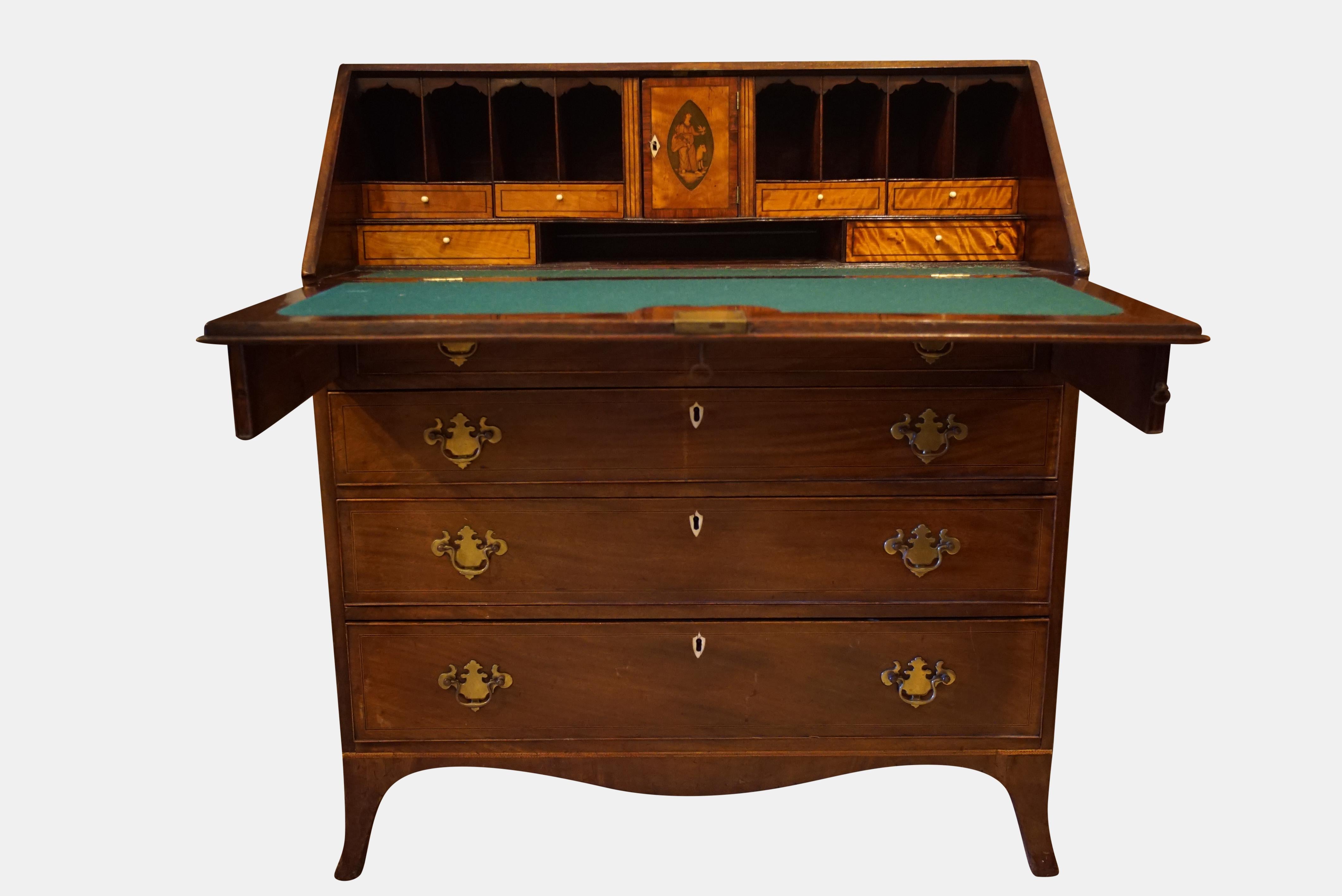 A George III inlaid mahogany bureau standing on bracket feet with a fine inlaid, stepped interior..

circa 1800.