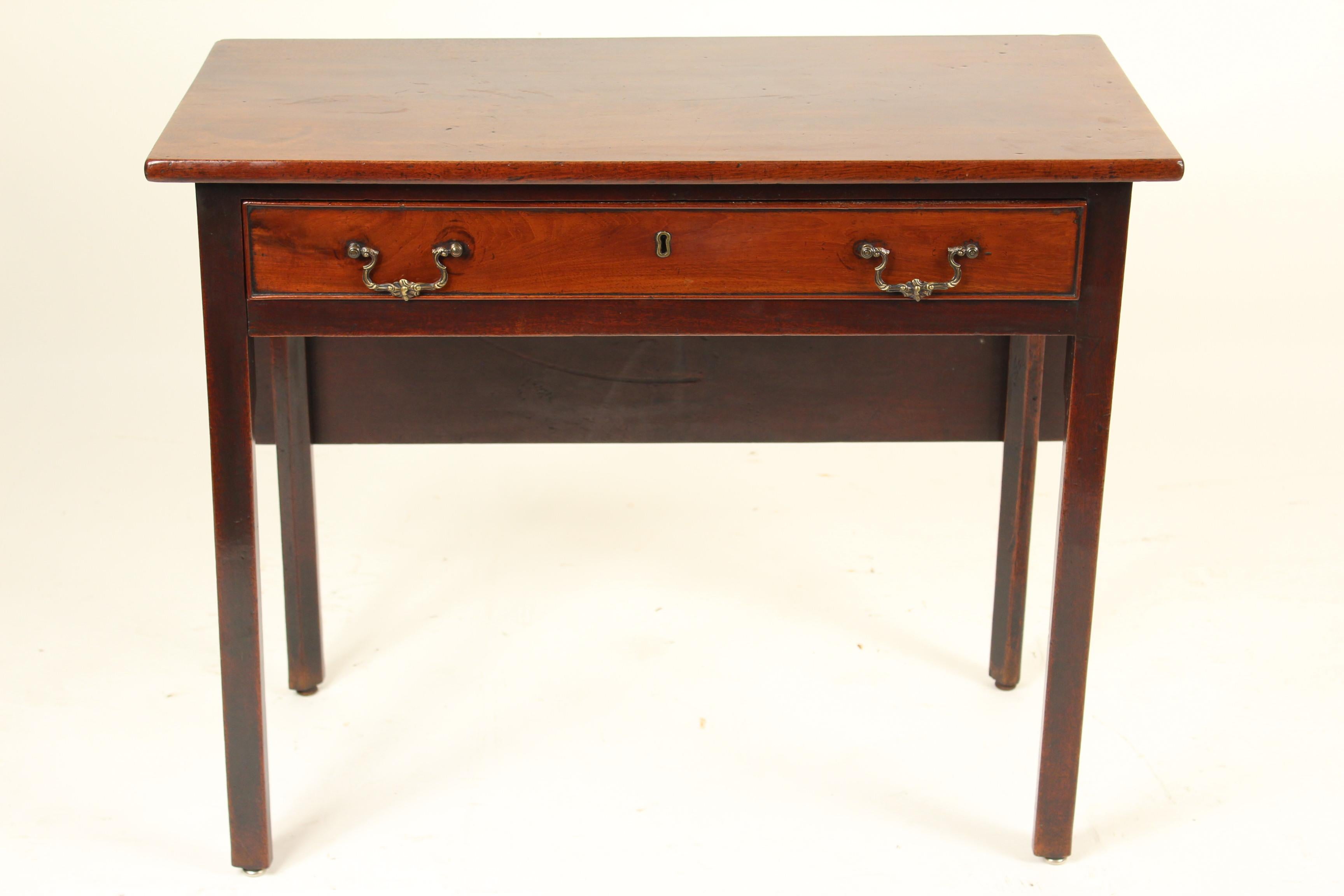 George II mahogany drop leaf games / side table, circa 1760. This is very versatile table can be used as a games table, side table or a lowboy. Both the top and drop leaf are single board slabs of mahogany with excellent color. The legs are 5 sided.