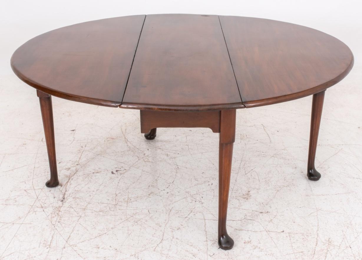 George II mahogany gate-leg dining or console table, the rectangular shaped top with D-shaped drop leaves, raised on tapered turned legs, circa late eighteenth century. Closed: 28