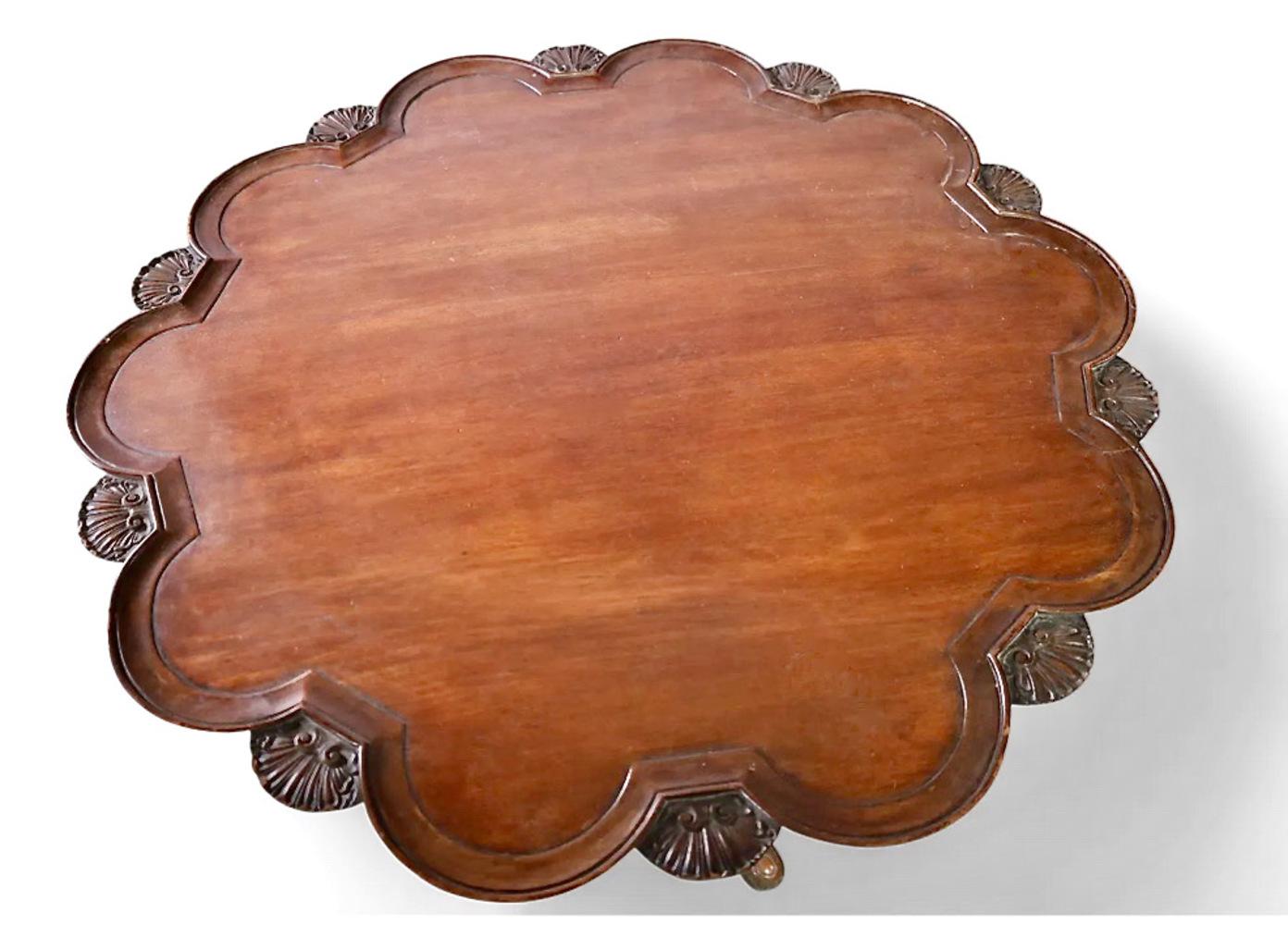 This is an outstanding example of a George II Mahogany Piecrust Tilt Top table. Although we have given the table an English origin, it is quite possibly Irish. The top surface of dark rich mahogany has mellowed over the years; the surface is old,
