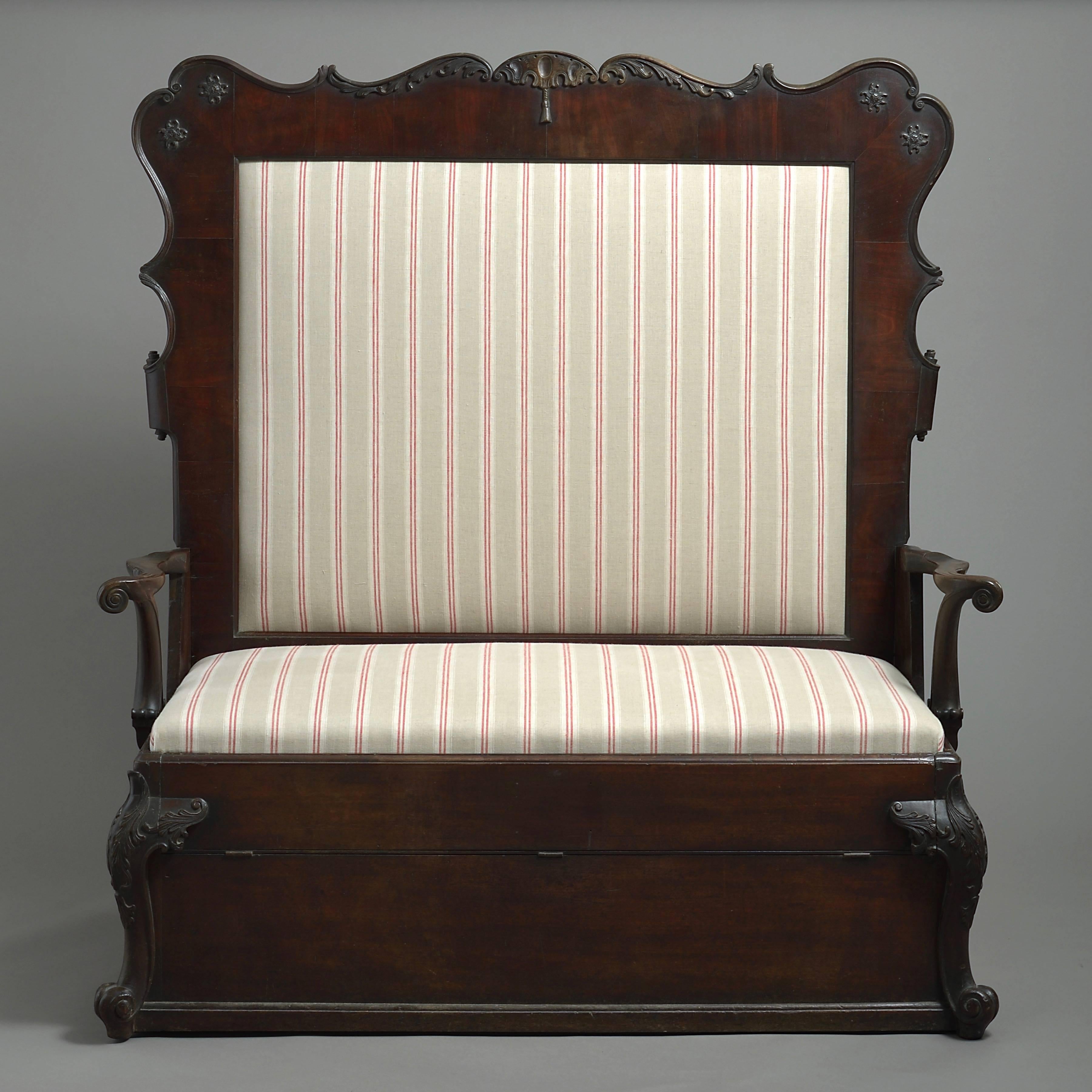 An Irish George II mahogany settee, circa 1750.

Formerly a settee-bed, the bed mechanism now missing.
