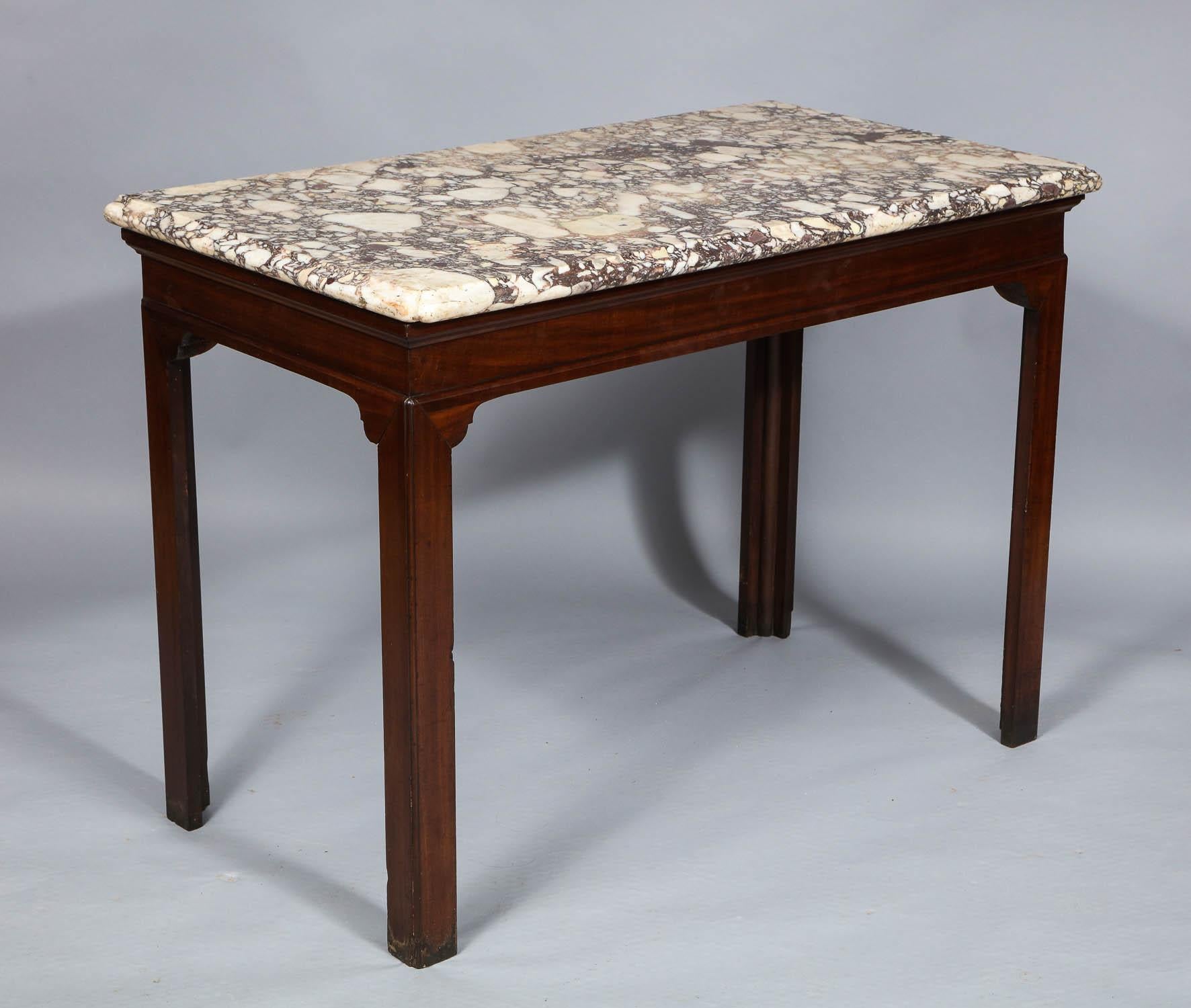 George II slab top table, the original Breche de Medici marble top with reentrant “baby bum” corners, over Chinese inspired mahogany base with mitered construction and retaining fantastic original surface. English, circa 1750.

47 ½ in. wide x 26